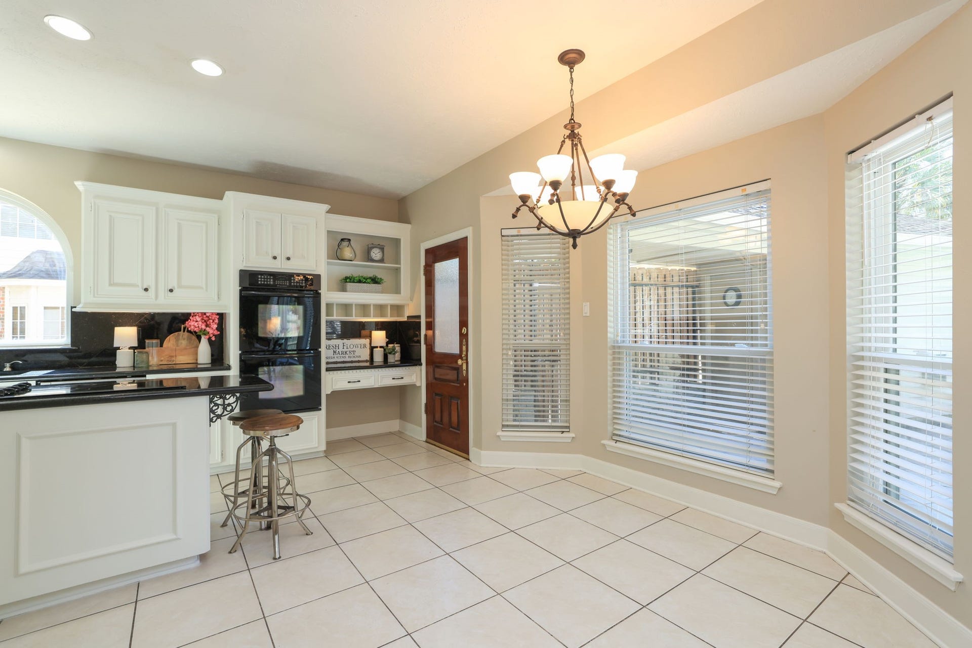 16107 Abberton Hill Drive, Spring, TX 77379 Charming breakfast nook surrounded by bay windows overlooking the backyard and pool area.