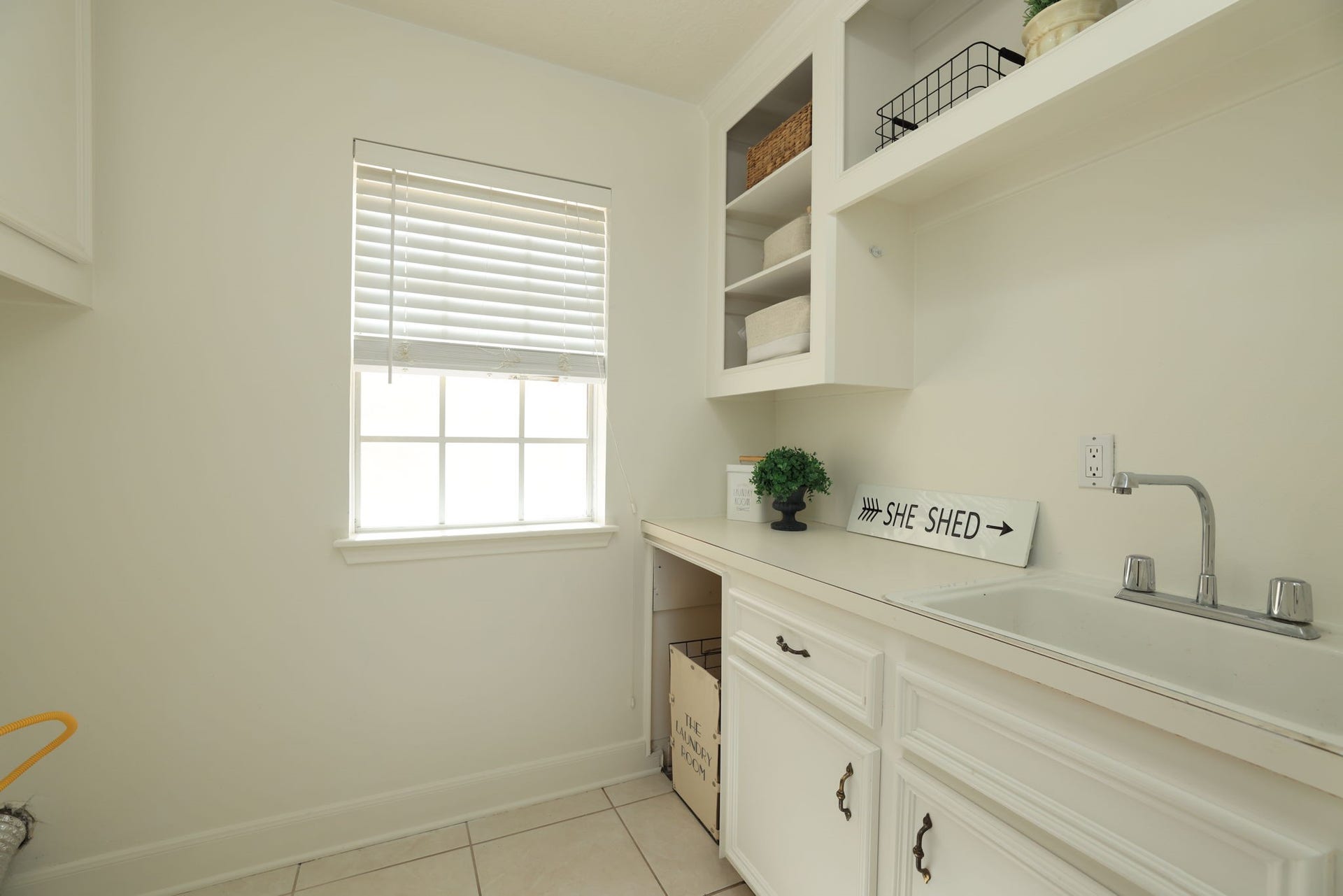 16107 Abberton Hill Drive, Spring, TX 77379 Convenient laundry area with built-in cabinets and ample workspace, perfectly located near the kitchen.