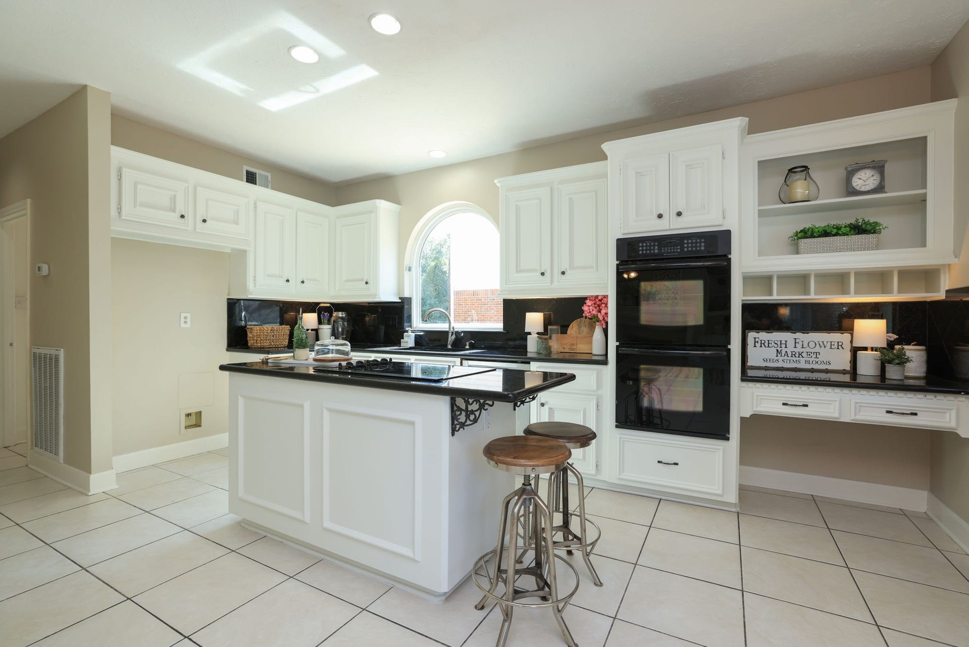 16107 Abberton Hill Drive, Spring, TX 77379 Crisp white cabinetry, granite counters, and built-in double ovens make this kitchen both functional and stylish.