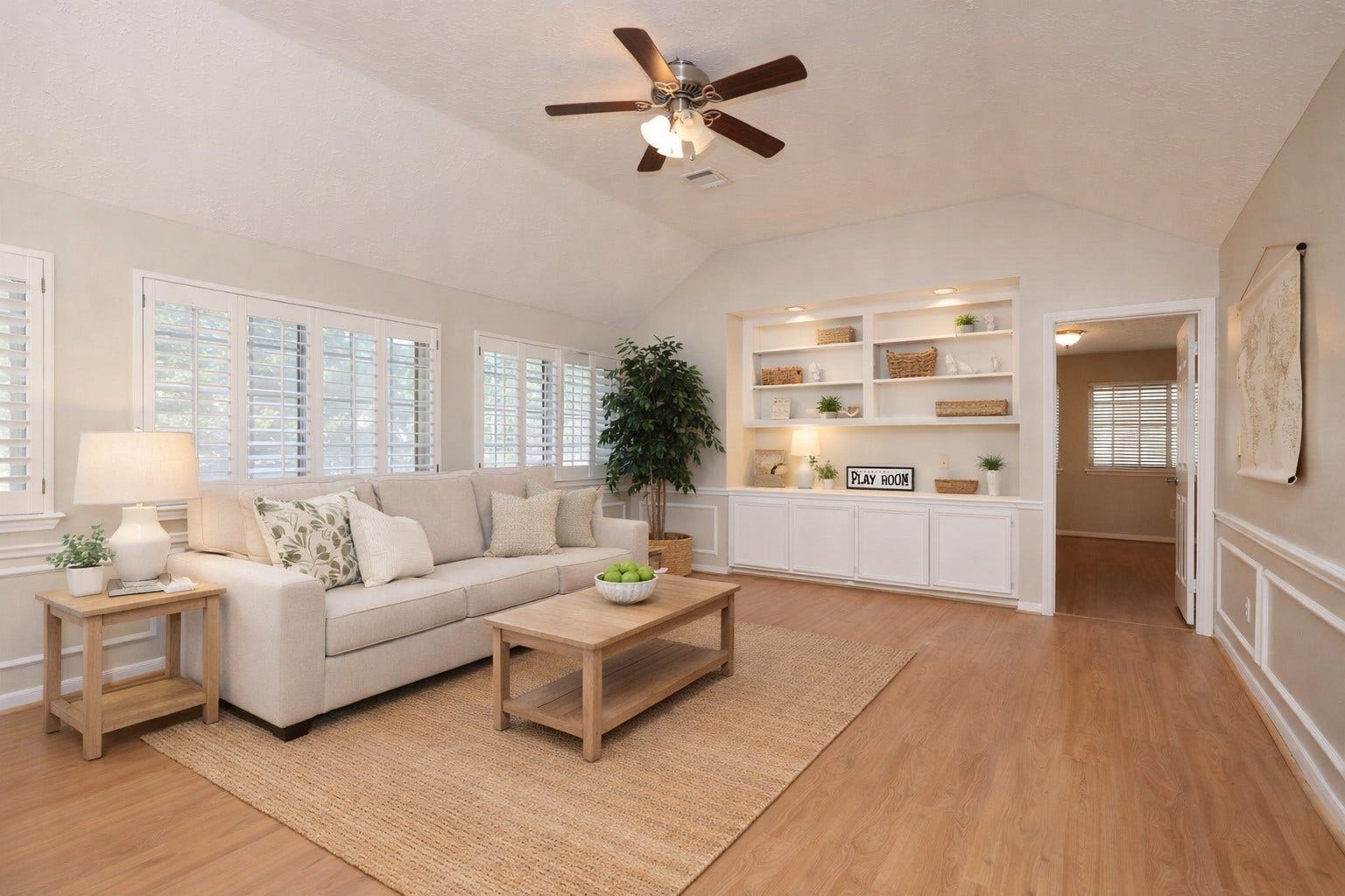 16107 Abberton Hill Drive, Spring, TX 77379 Virtually staged - Spacious upstairs game room with wood-look flooring, custom built-ins, and plantation shuttersideal for a playroom or media space.