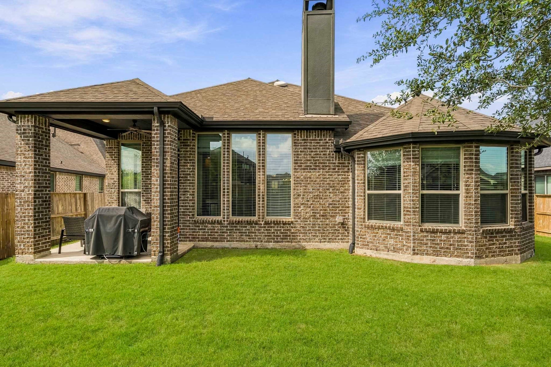 The covered patio is perfect for your outdoor living space, patio furniture, BBQ pit, and so much more! It connects to the kitchen, making it easy for indoor-outdoor living.