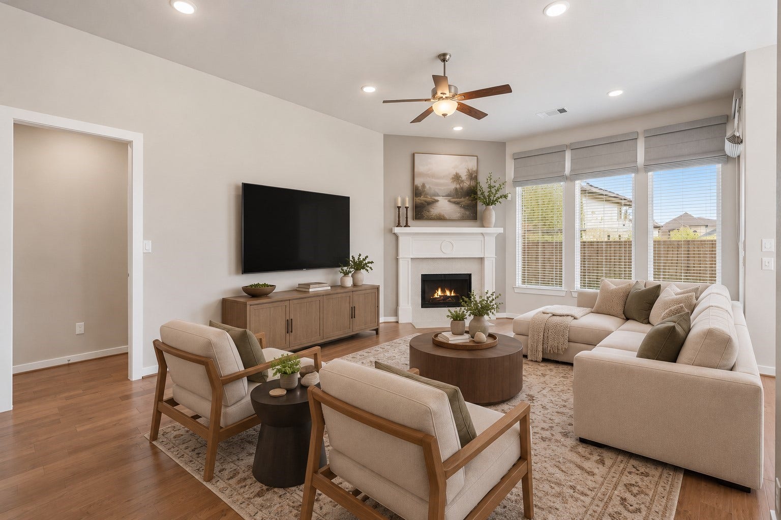 Whether it's a simple night in or entertaining family and friends, this home has ample open space for everyone to enjoy! Featuring a ceiling fan, recessed lighting, and luxurious wood look floors this living space offers it all. *This room has been virtually staged