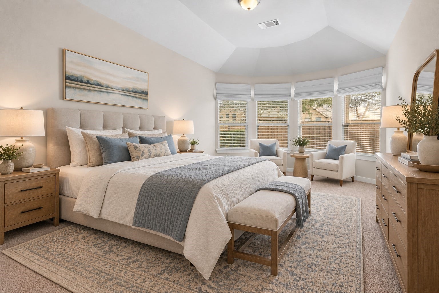The primary bedroom welcomes you with bright natural light, an upgraded bay window with a relaxing sitting area, and the perfect view of the serene yard. It sits at the back of the home offering additional privacy and easily fits a king size bed plus furniture!  *This room has been virtually staged