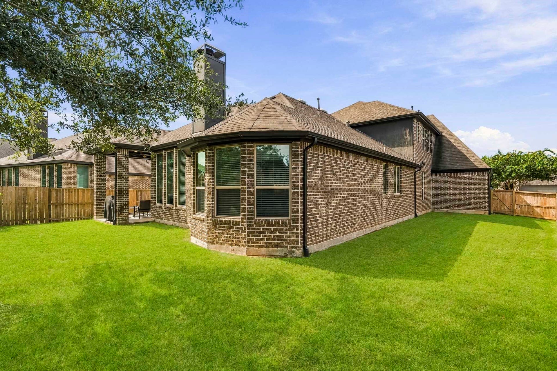 Enjoy the outdoors in this spacious and low-maintenance backyard! With plenty of room for play, gardening, or relaxing, this private outdoor space is the perfect blank canvas to make your own.