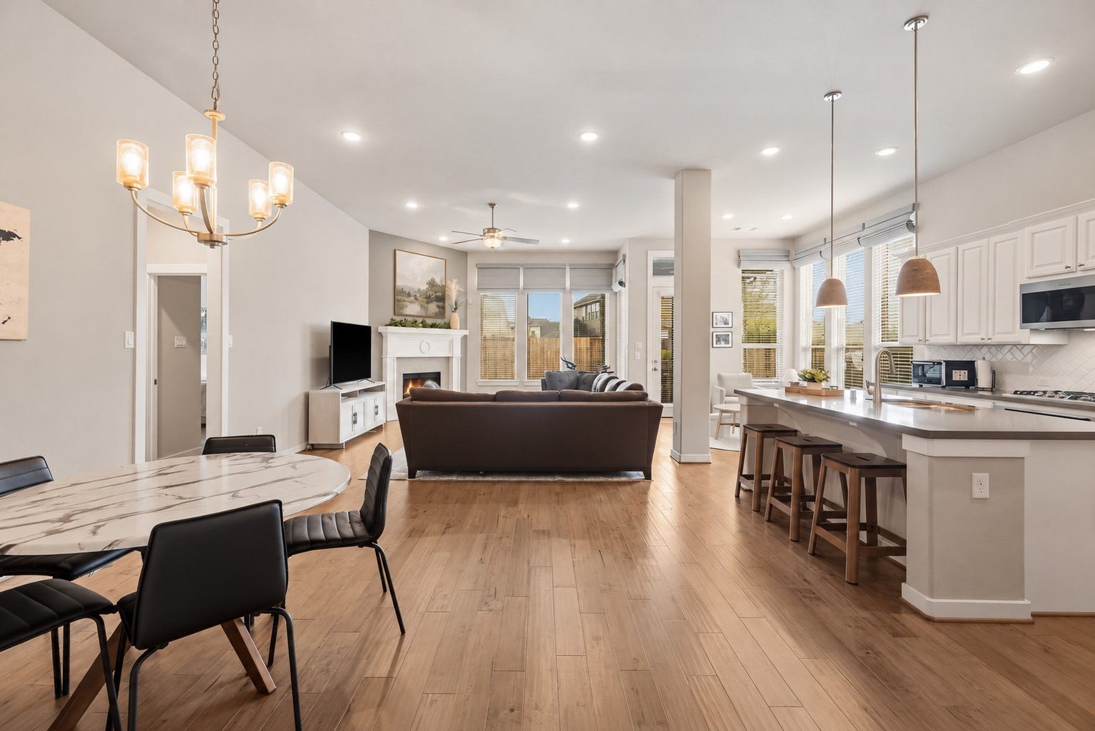 Walking in, you are greeted by a light and open space! This large open concept layout will not disappoint and offers high ceilings, recessed lighting, custom window coverings, and large windows letting in tons of natural light.