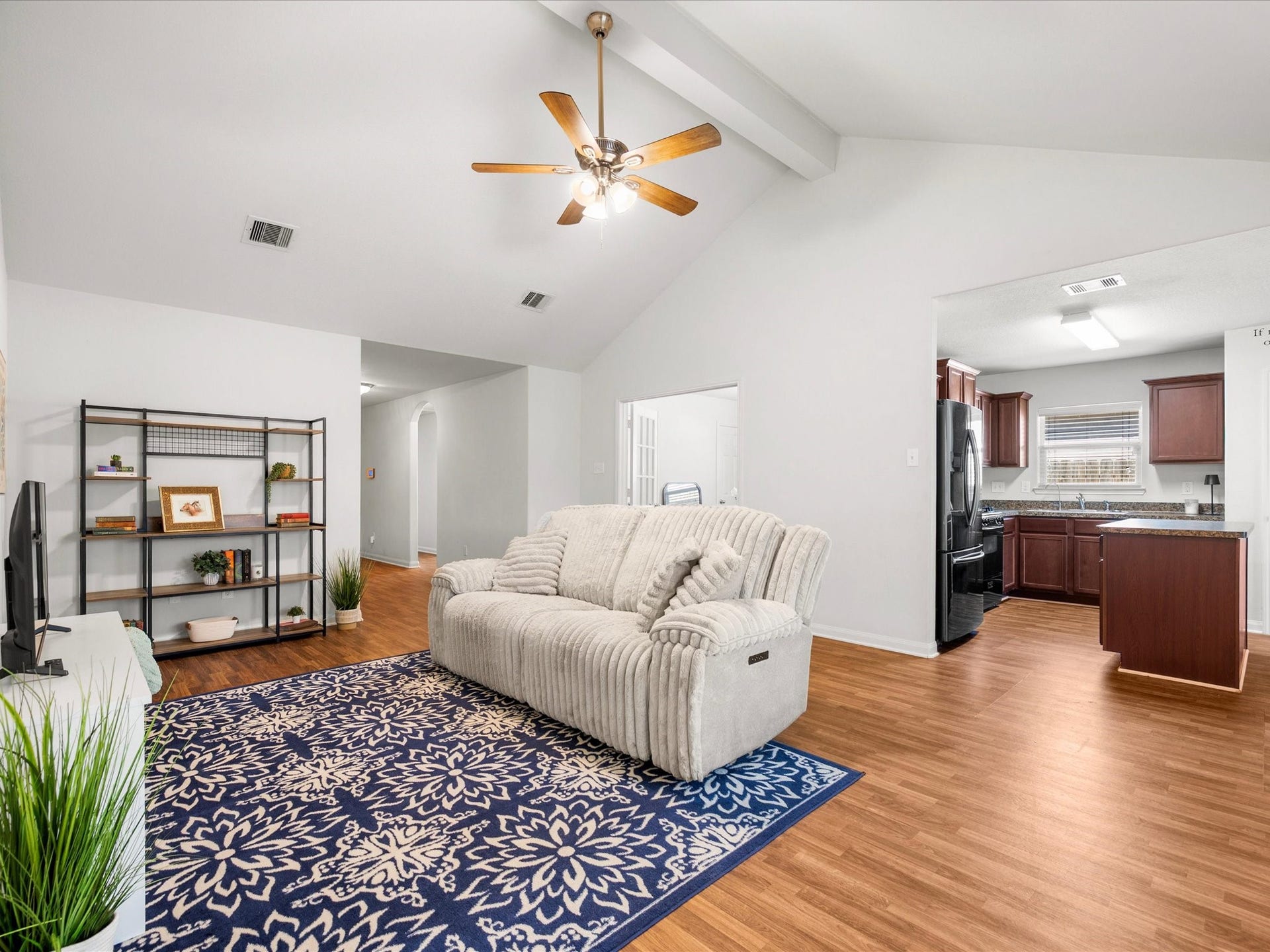 305 Pine Mist Lane, Conroe, TX 77304 An open layout connects the living room and kitchen, making everyday living and entertaining easy.
