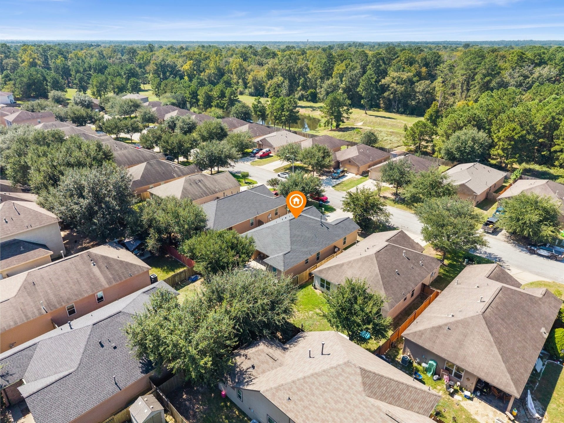 305 Pine Mist Lane, Conroe, TX 77304 An aerial view of Pinewood Forest and the expansive wooded areas surrounding the community.