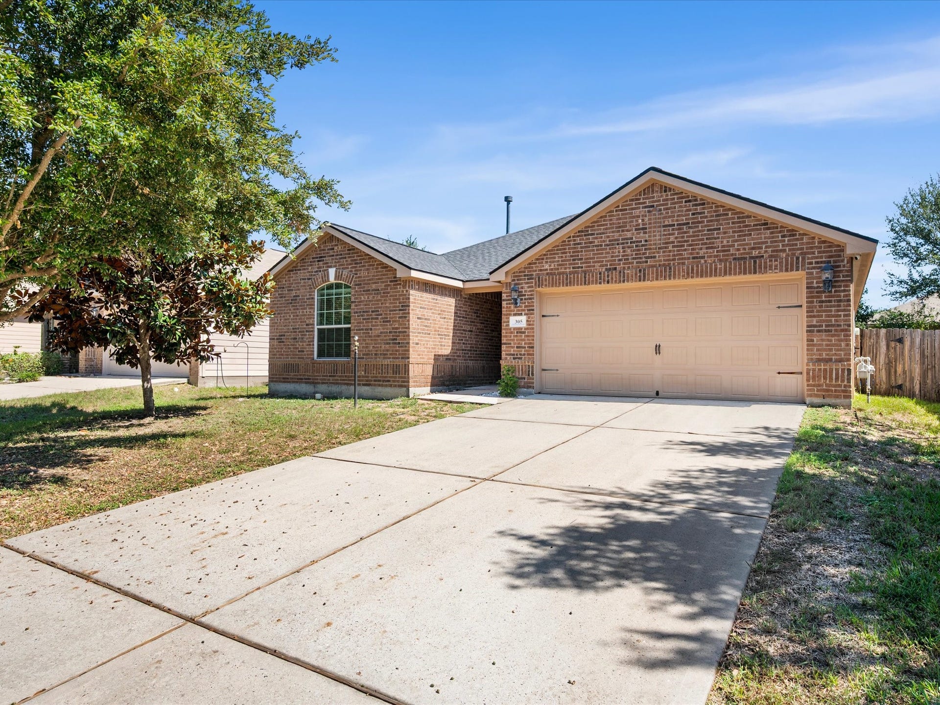 305 Pine Mist Lane, Conroe, TX 77304 Welcome to Pinewood Forest, an inviting tree lined neighborhood