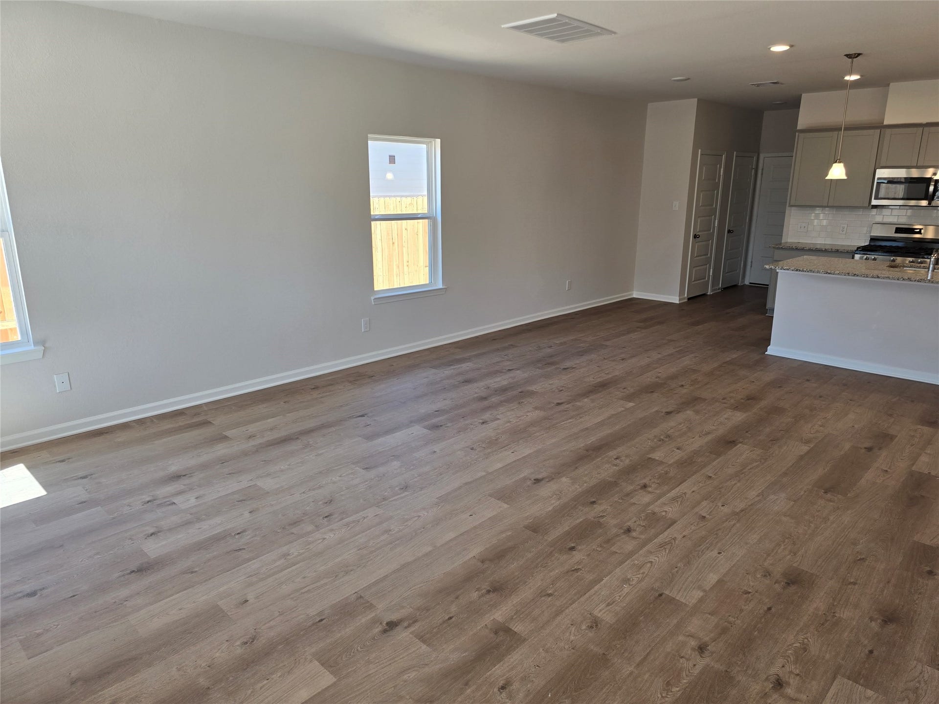 1920 N Riverside Circle, Dayton, TX 77535 The Shetland III- Family Room. Home under construction, photo used for illustrative purposes only, colors and options will vary.