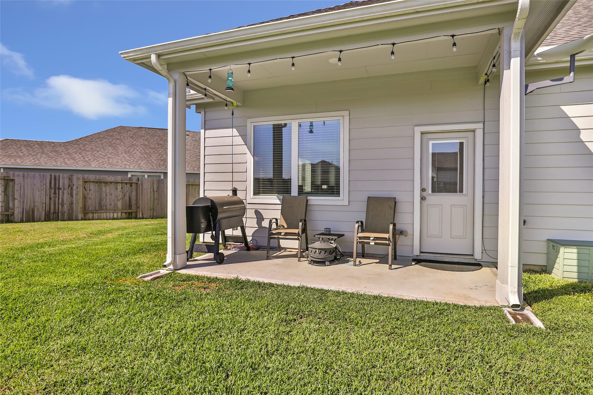 Discover the perfect outdoor retreat with a spacious covered patio, ideal for relaxing or entertaining.
