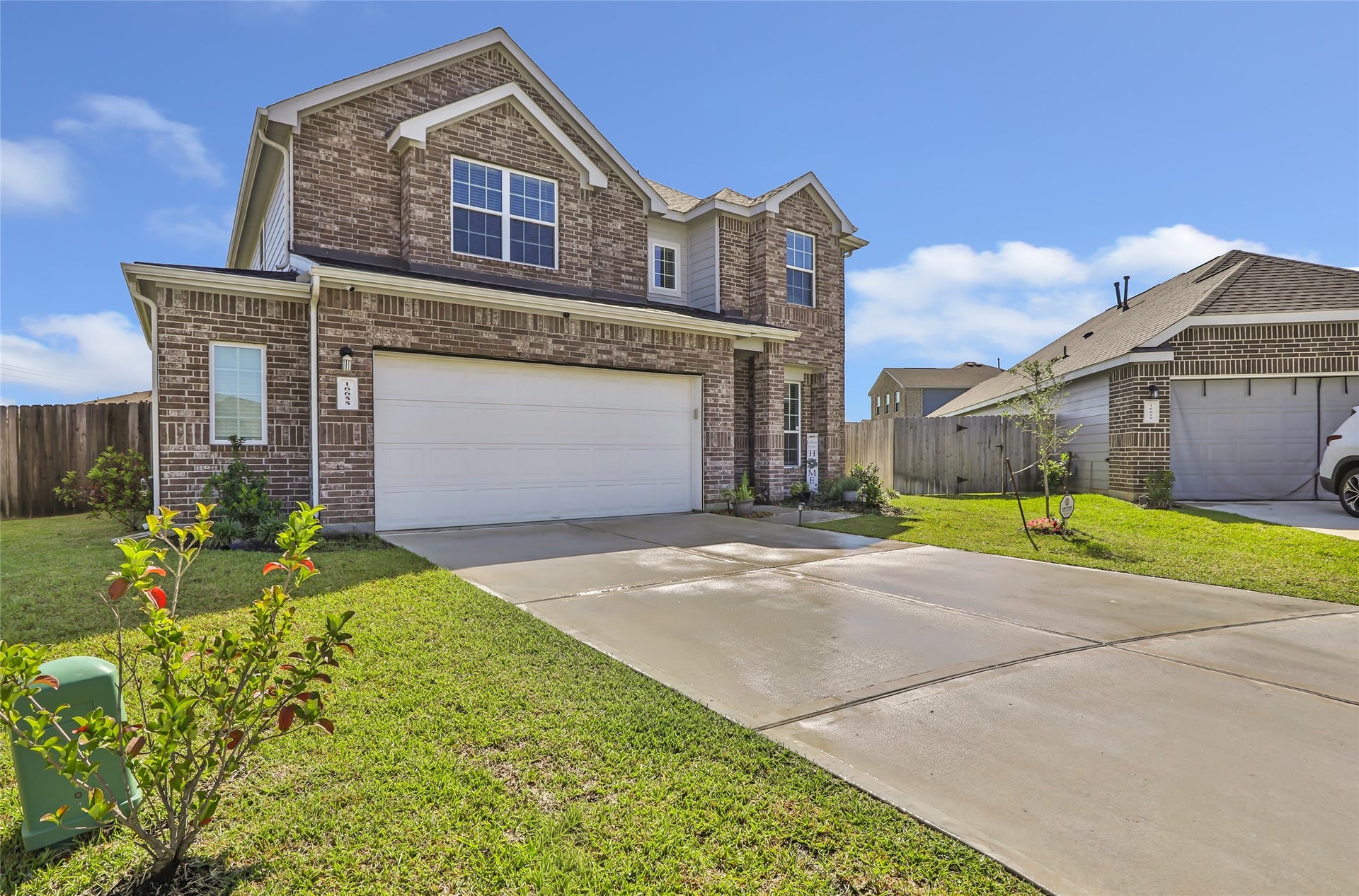 Spacious double driveway with an expansive garage.