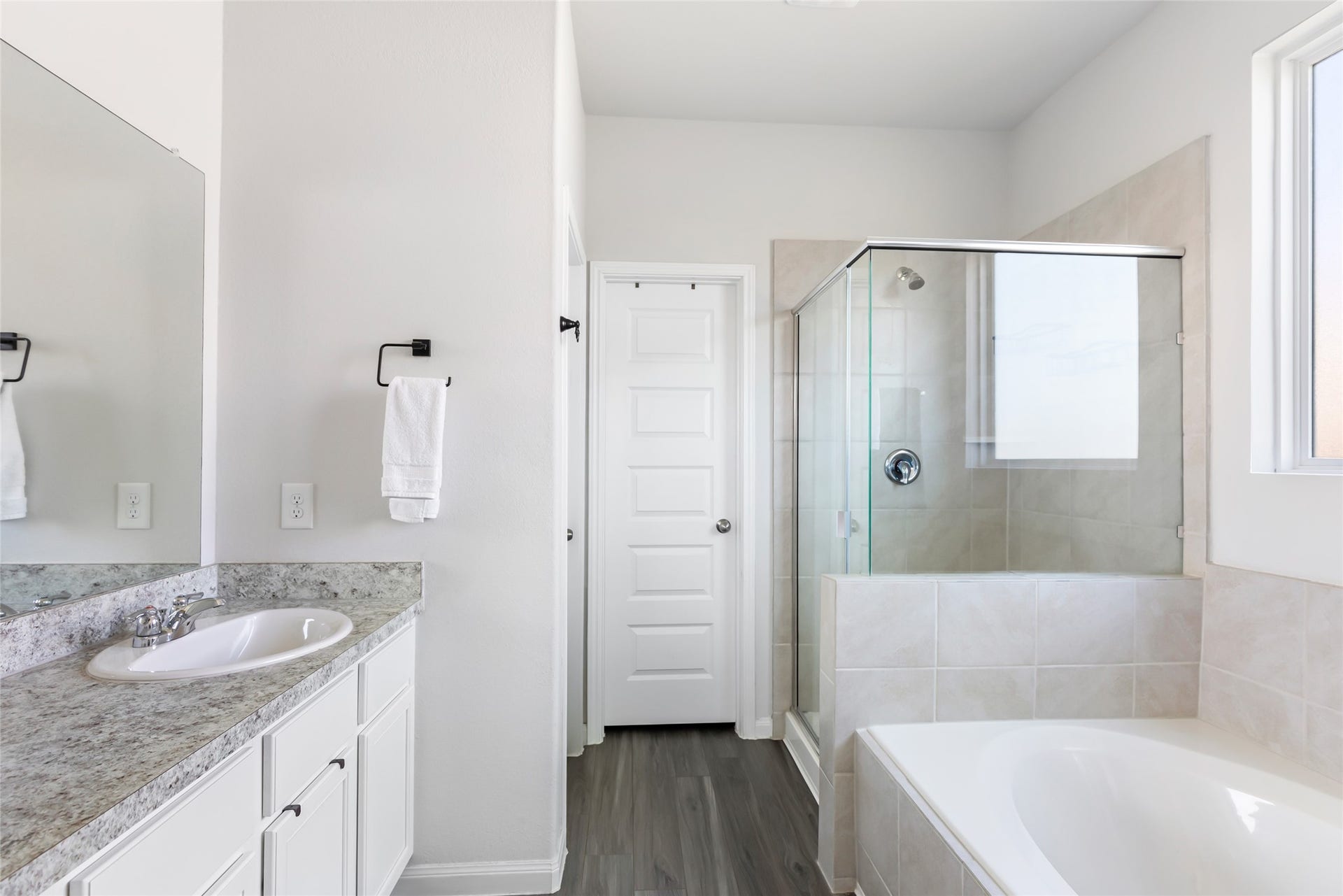 Indulge in the primary ensuite with a luxurious soaking tub and separate shower.