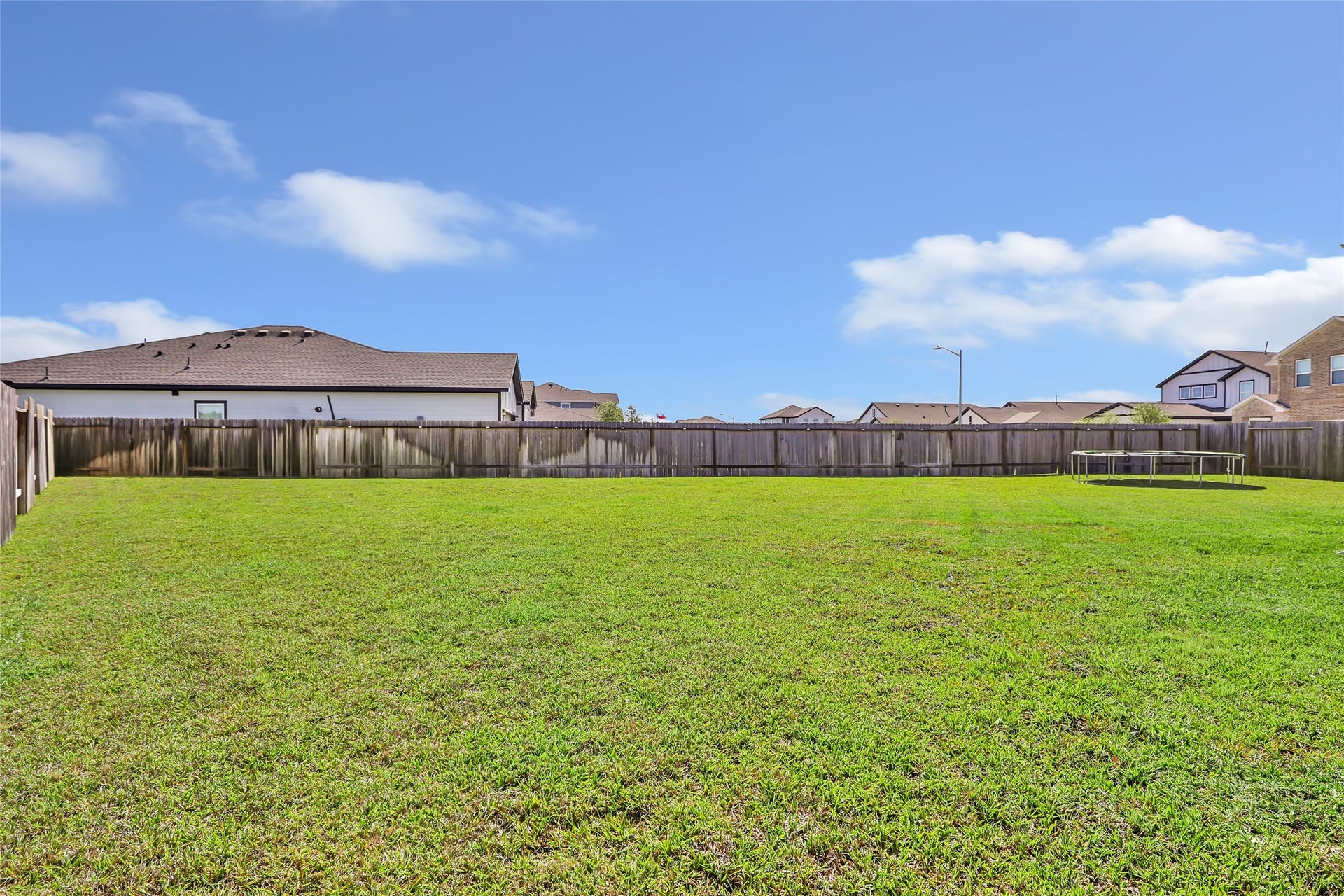 Discover one of the most spacious lots in Granger Pines, ideal for outdoor living.