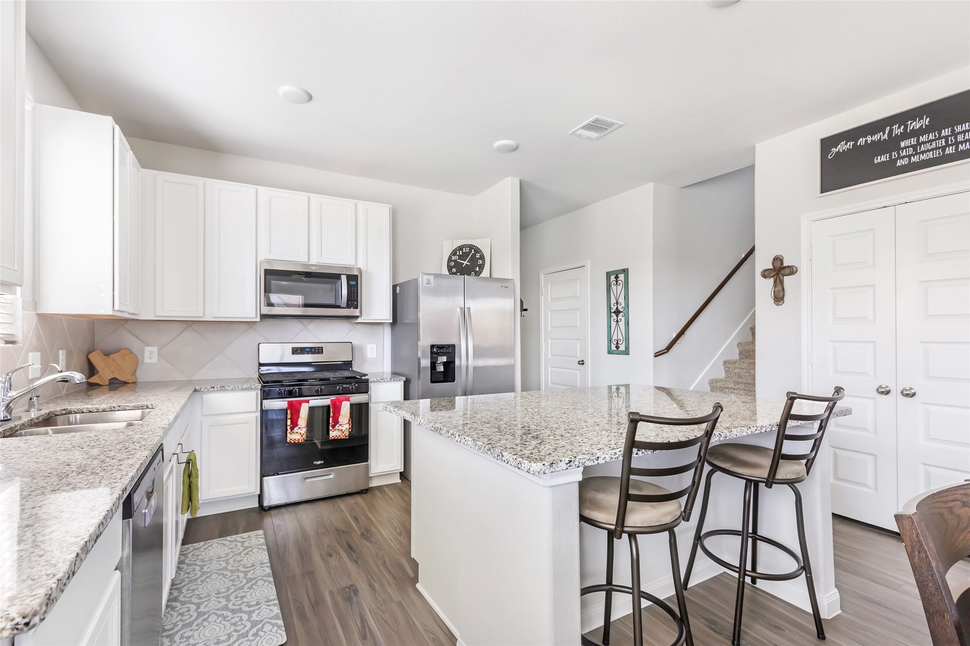 Experience modern elegance with granite countertops and sleek stainless steel appliances.