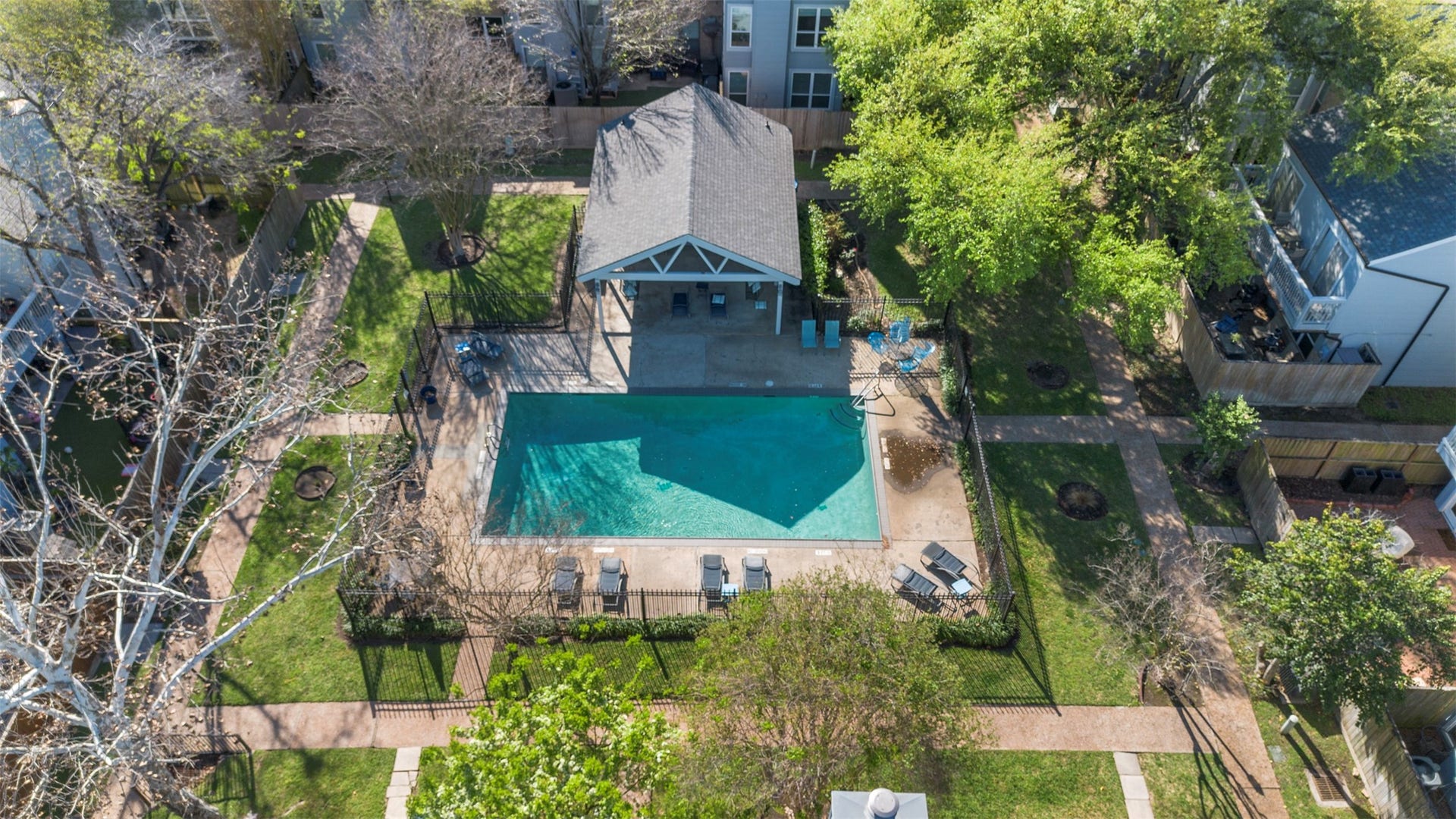 One of the two community pools alongside a clubhouse available for gatherings