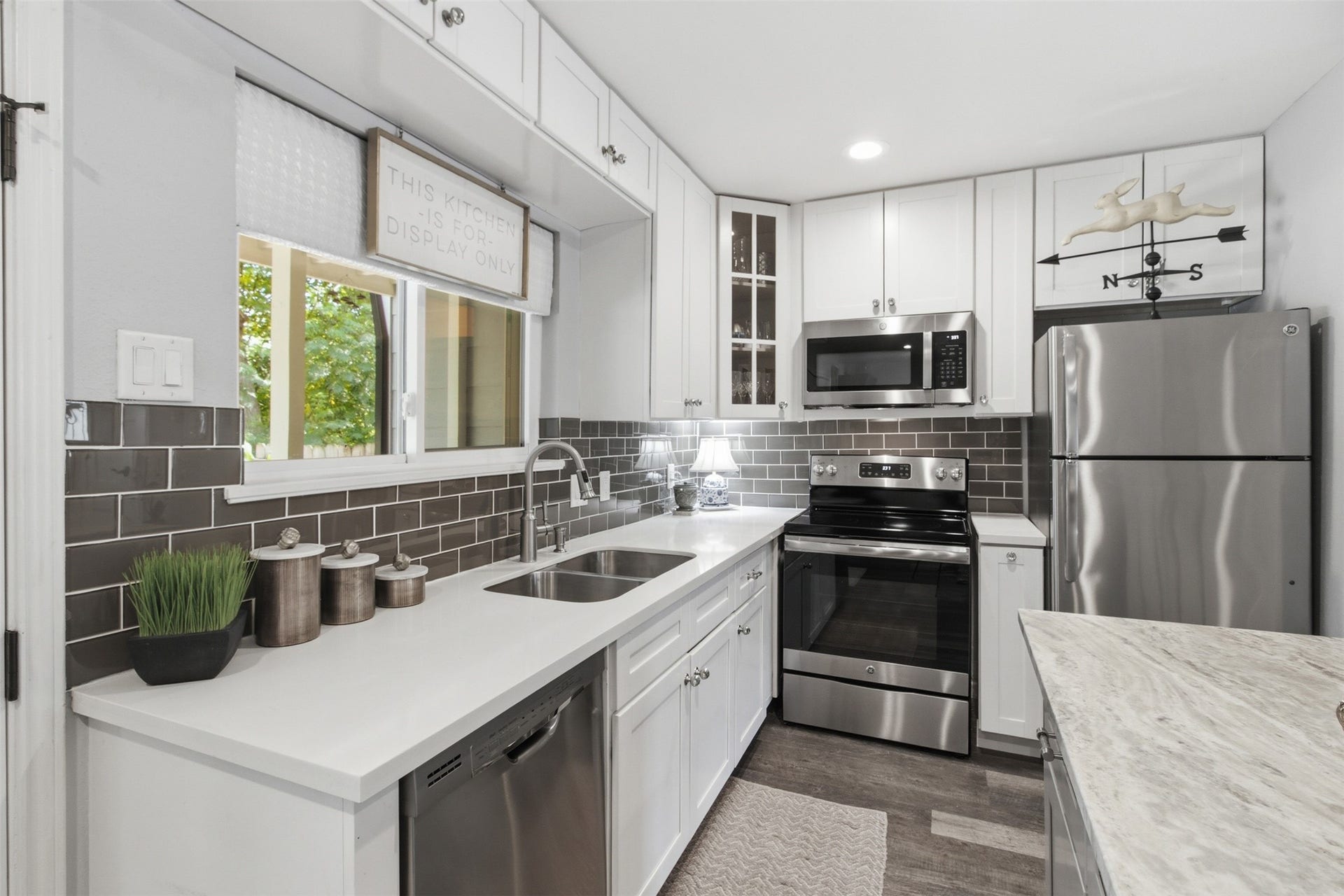 Well-appointed kitchen with stainless steel appliances, abundant counter space, and modern finishes.