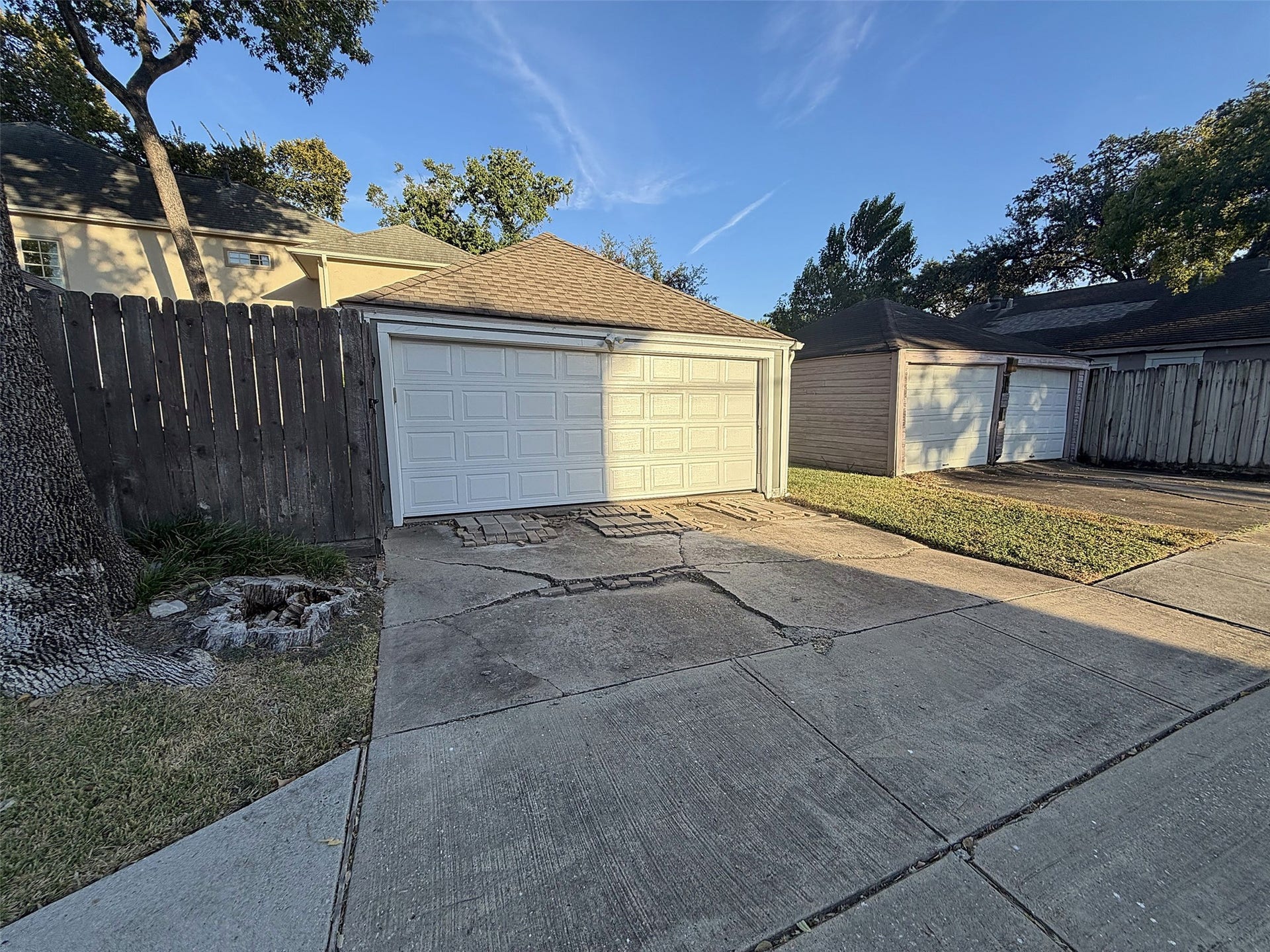 Detached Garage: Exterior view of the detached two-car garage and private driveway on Wesleyan.