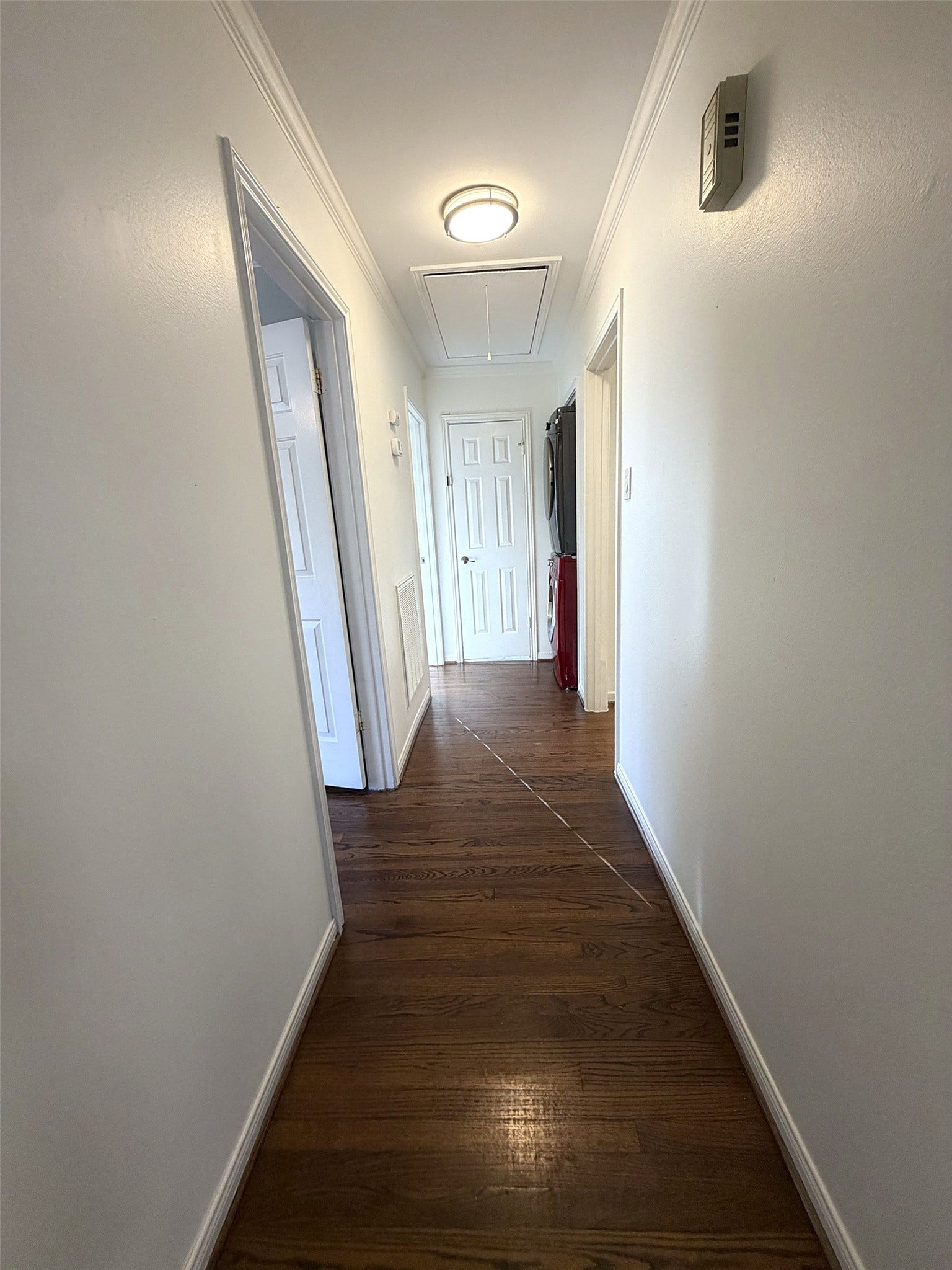 The hall bathroom (outside the bedrooms) has a stacked washer and dryer in the hallway and leads to the second bathroom.