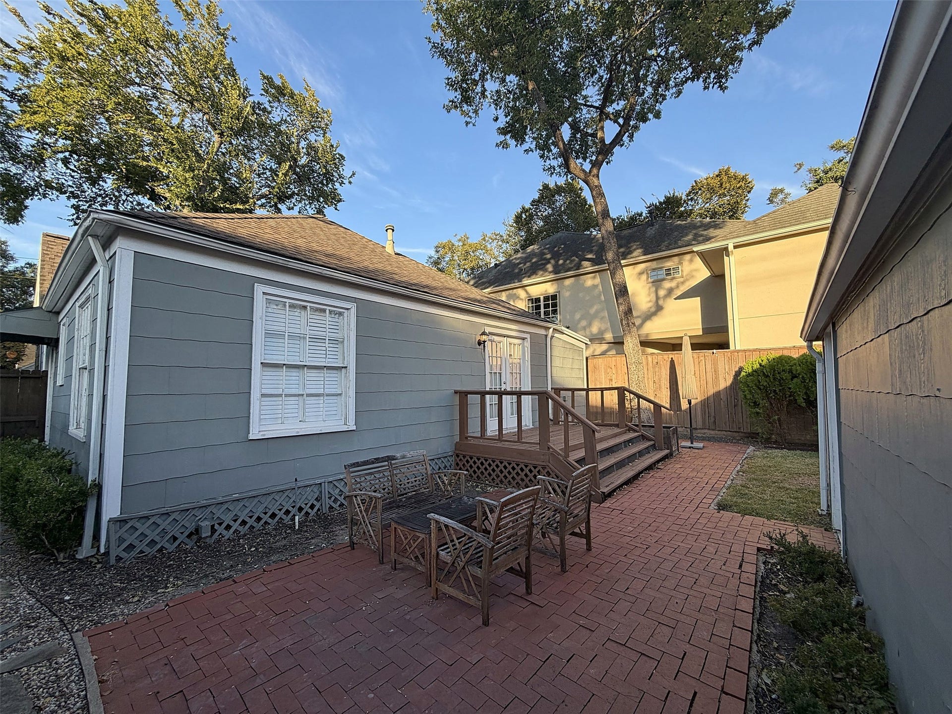 Outdoor Patio: Brick-paved patio with comfortable outdoor seating and attractive landscaping.