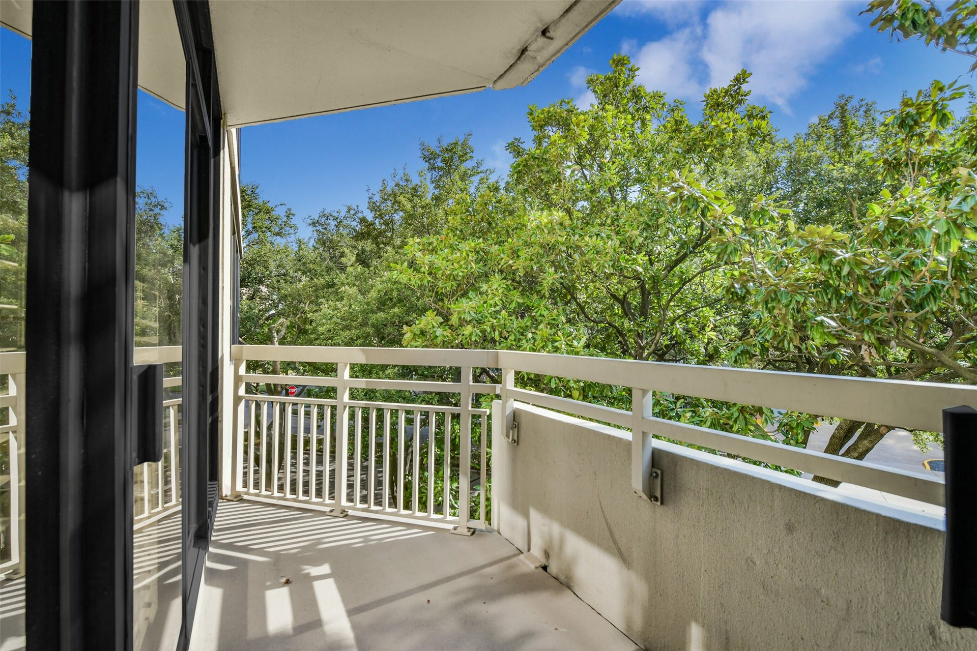 15 Greenway Plaza, #3B, Houston, TX 77046 The primary and the secondary bedroom have access to the private balcony with tree top views.