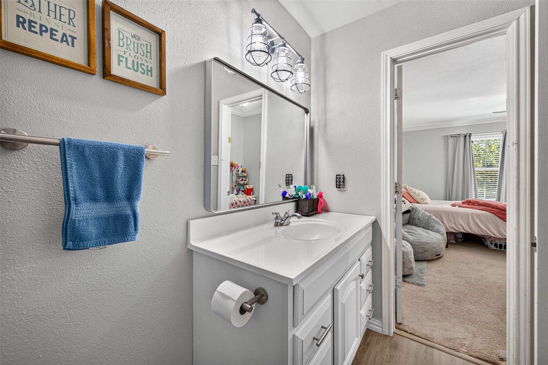 View of the upstairs bathroom vanity adjoining the first bedroom