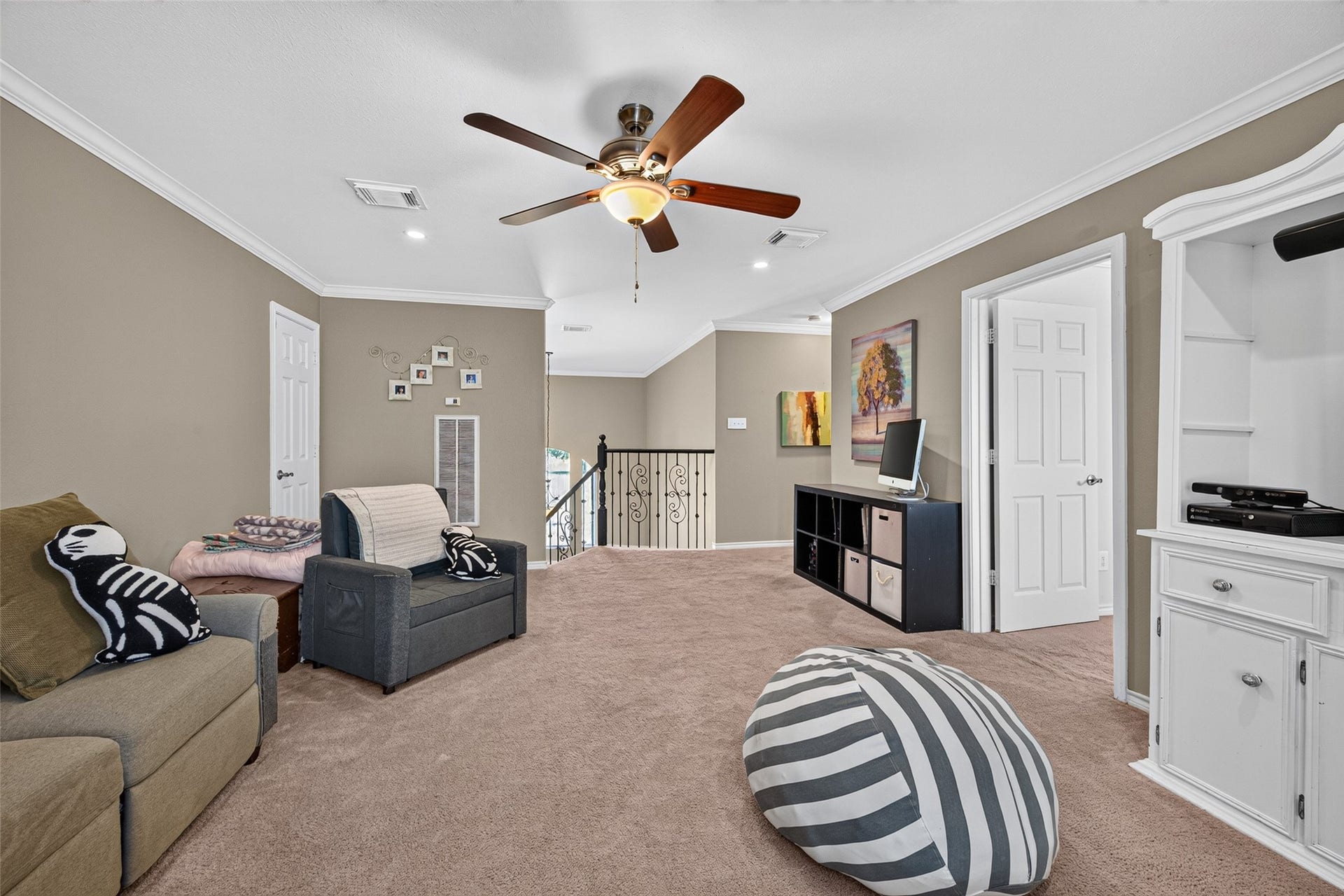 Additional view of the game room highlighting its open layout and multiple furnishing possibilities