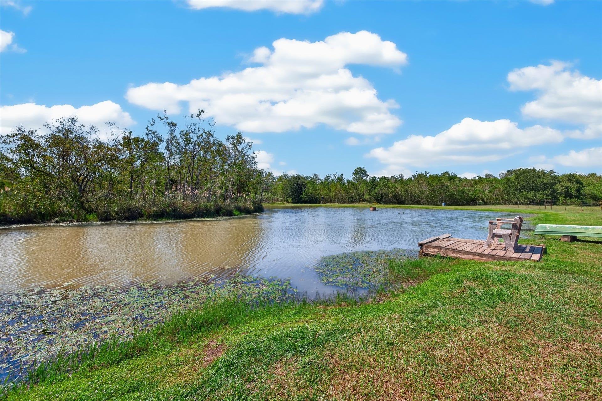 Scenic, one-acre pond is aerated and swimmable and has a waterside platform