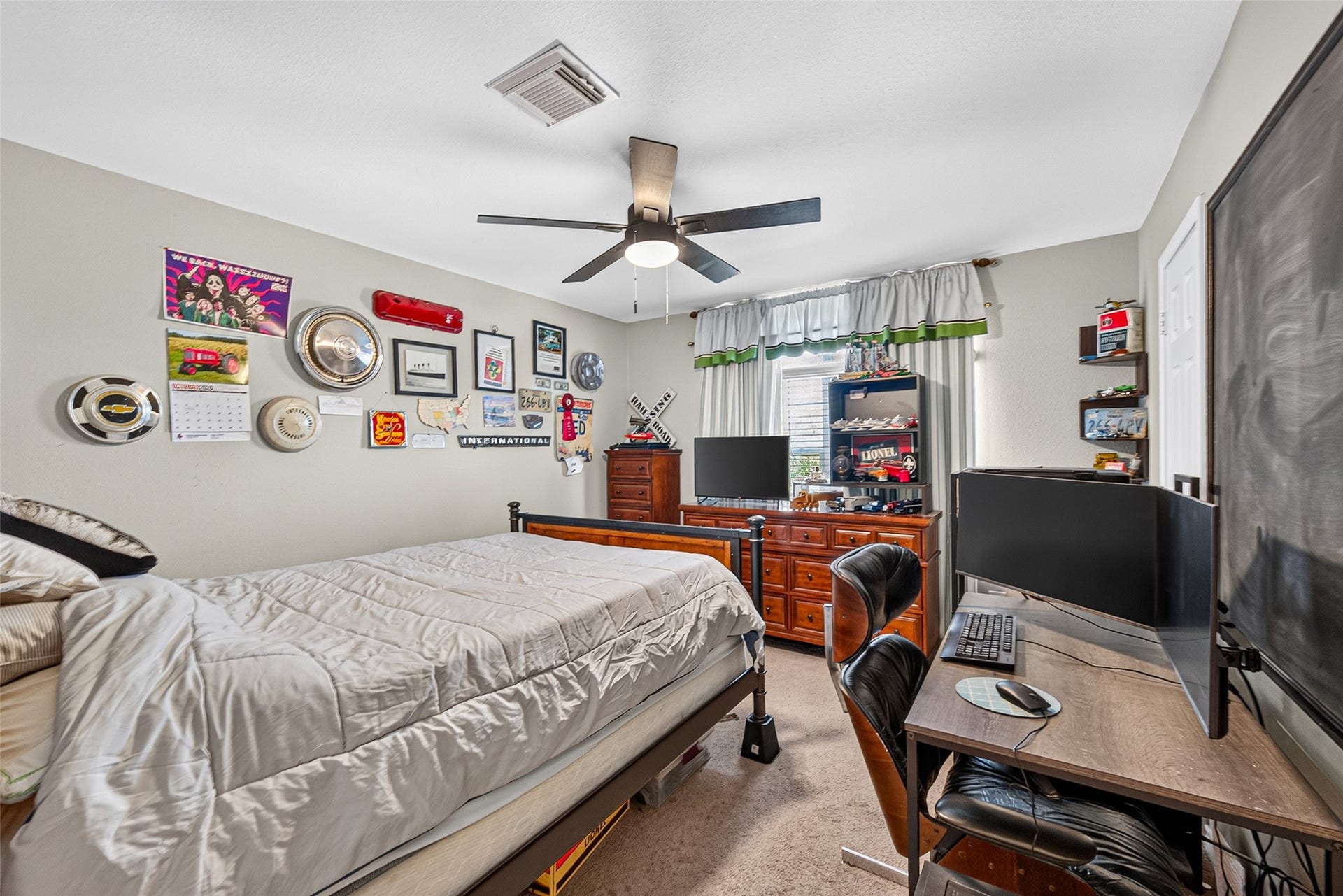 Second upstairs bedroom features ample space for large furnishings and a large window