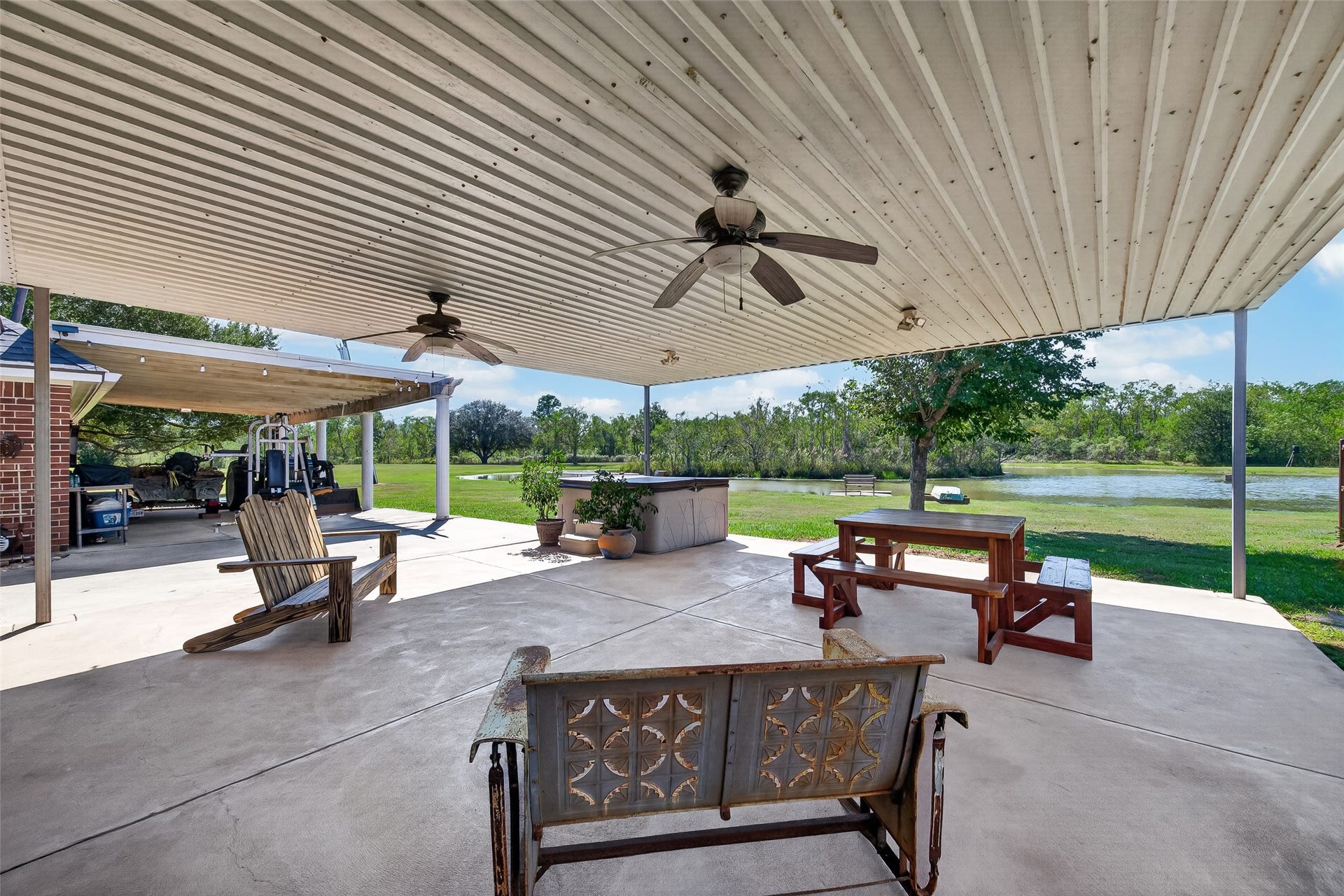 Covered outdoor lounge area has views across the grounds