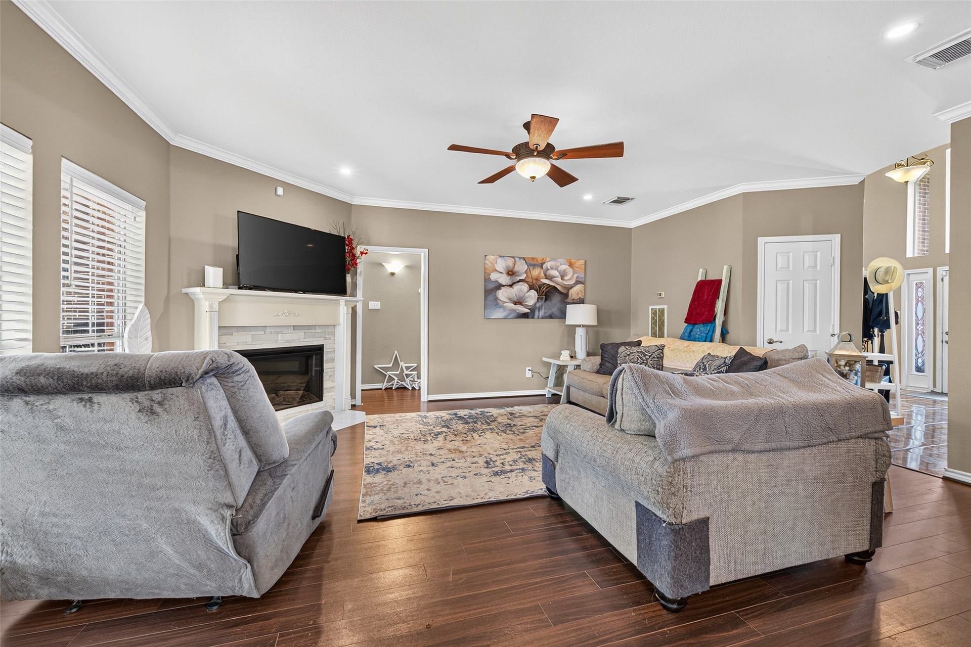 Spacious living area with open-concept layout and laminate flooring