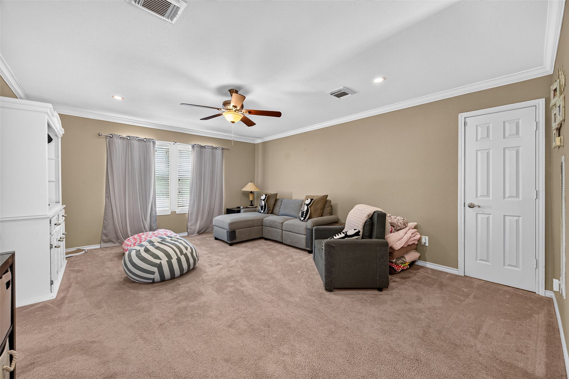 Generously sized, upstairs game room offers a flexible space for recreation or relaxation