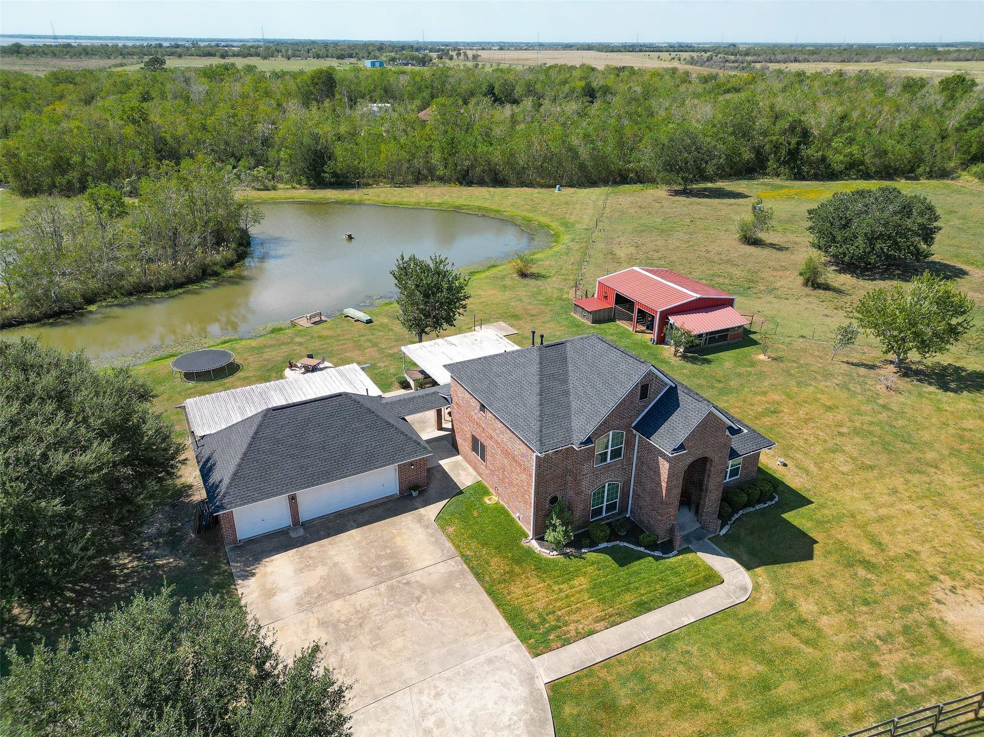 This view is above the driveway up to the three-car garage