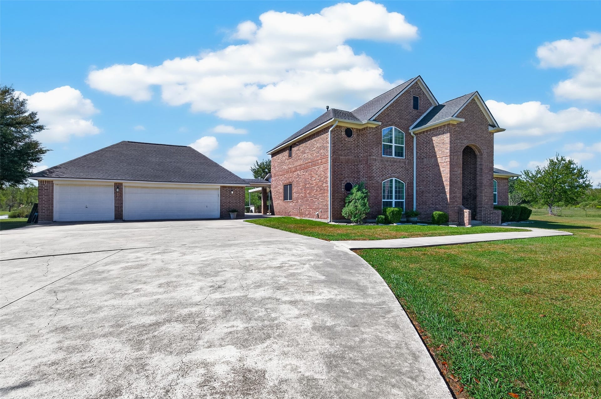 Oversized driveway with detached 3-car garage