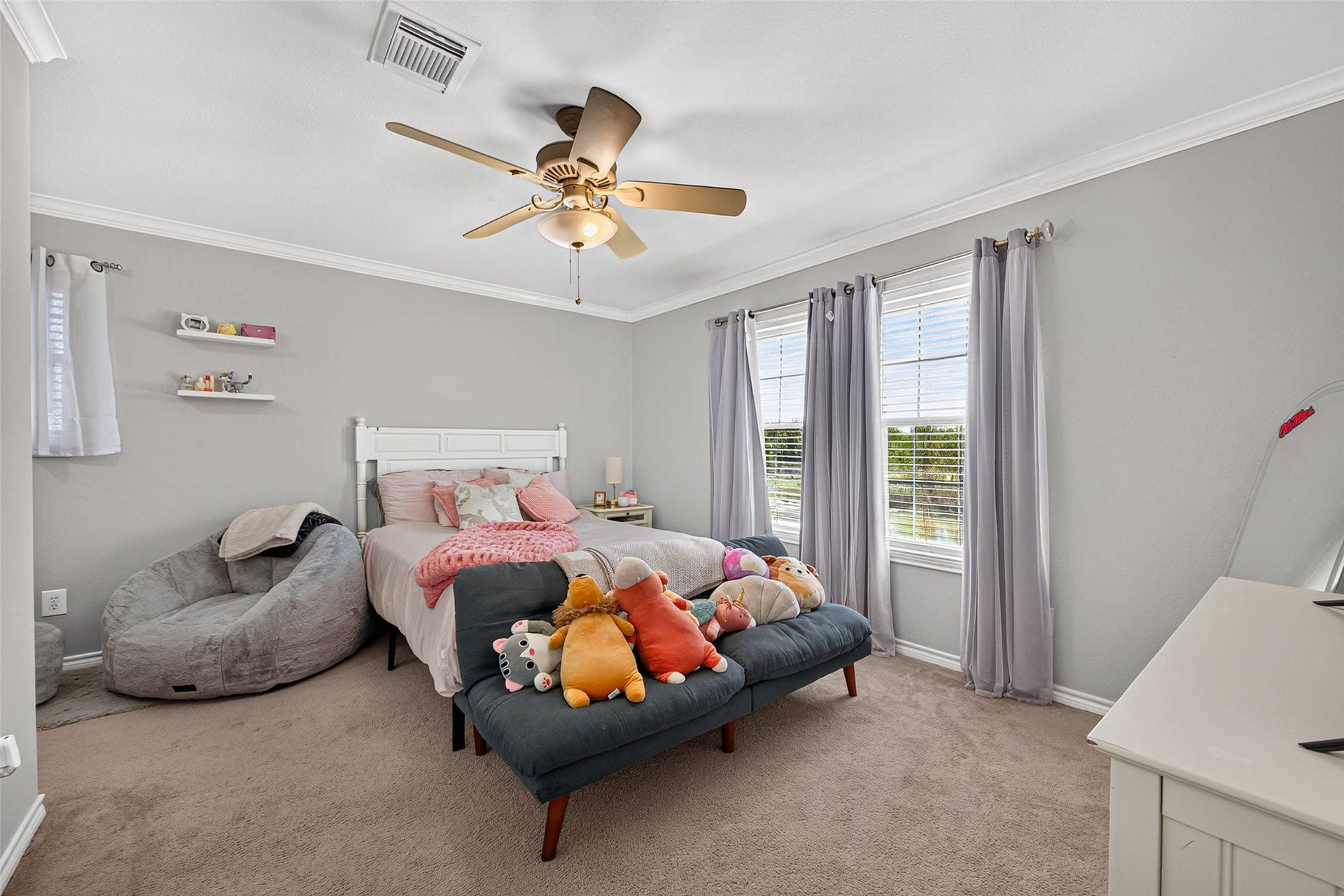 First upstairs bedroom is beside the gameroom and features a large window