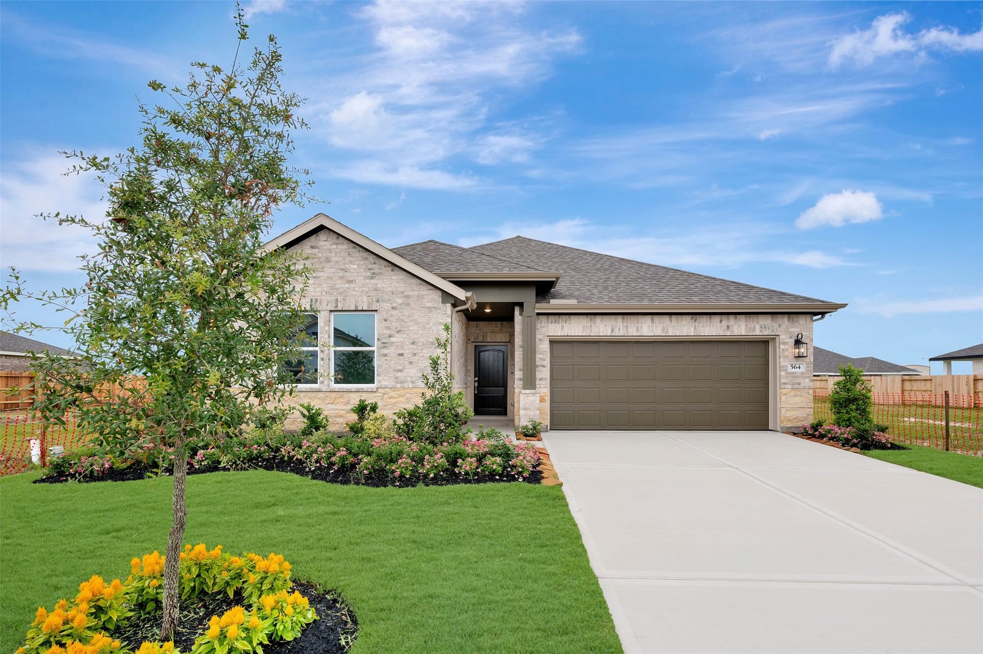 564 Day Station Drive, Dayton, TX 77535 Lovely Passionflower II design by K. Hovnanian Homes in elevation RA built in Aspire at River Ranch Trails.