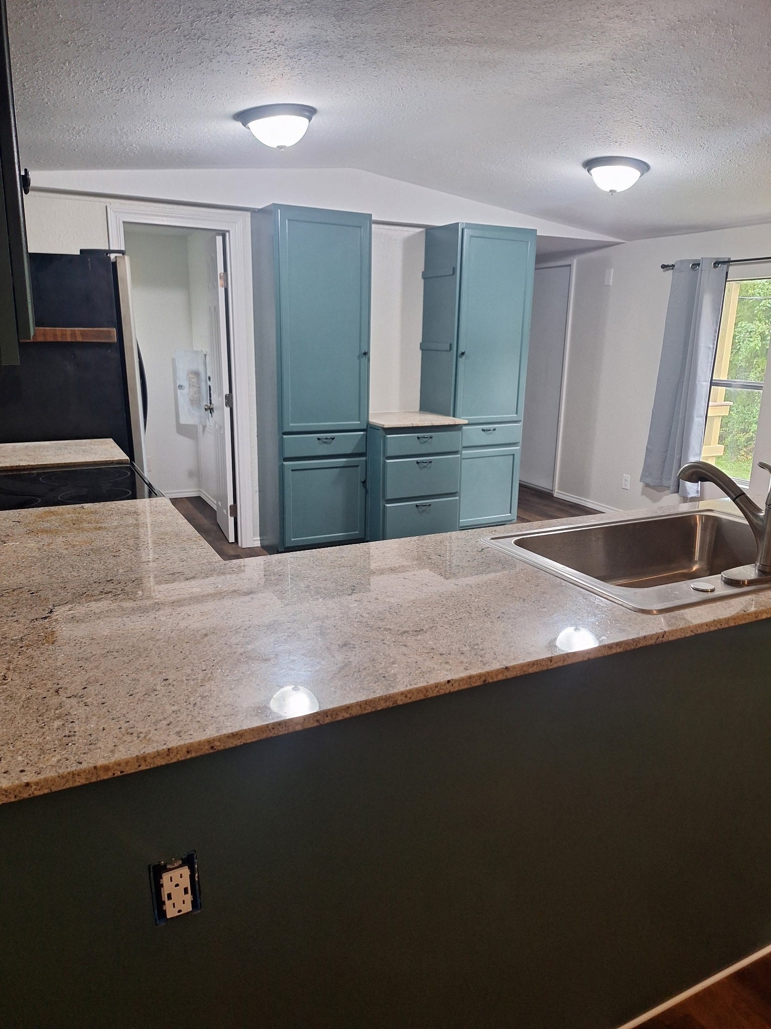 1308 County Road 159, Alvin, TX 77511 Open living and kitchen area offering a functional layout and comfortable everyday living space.