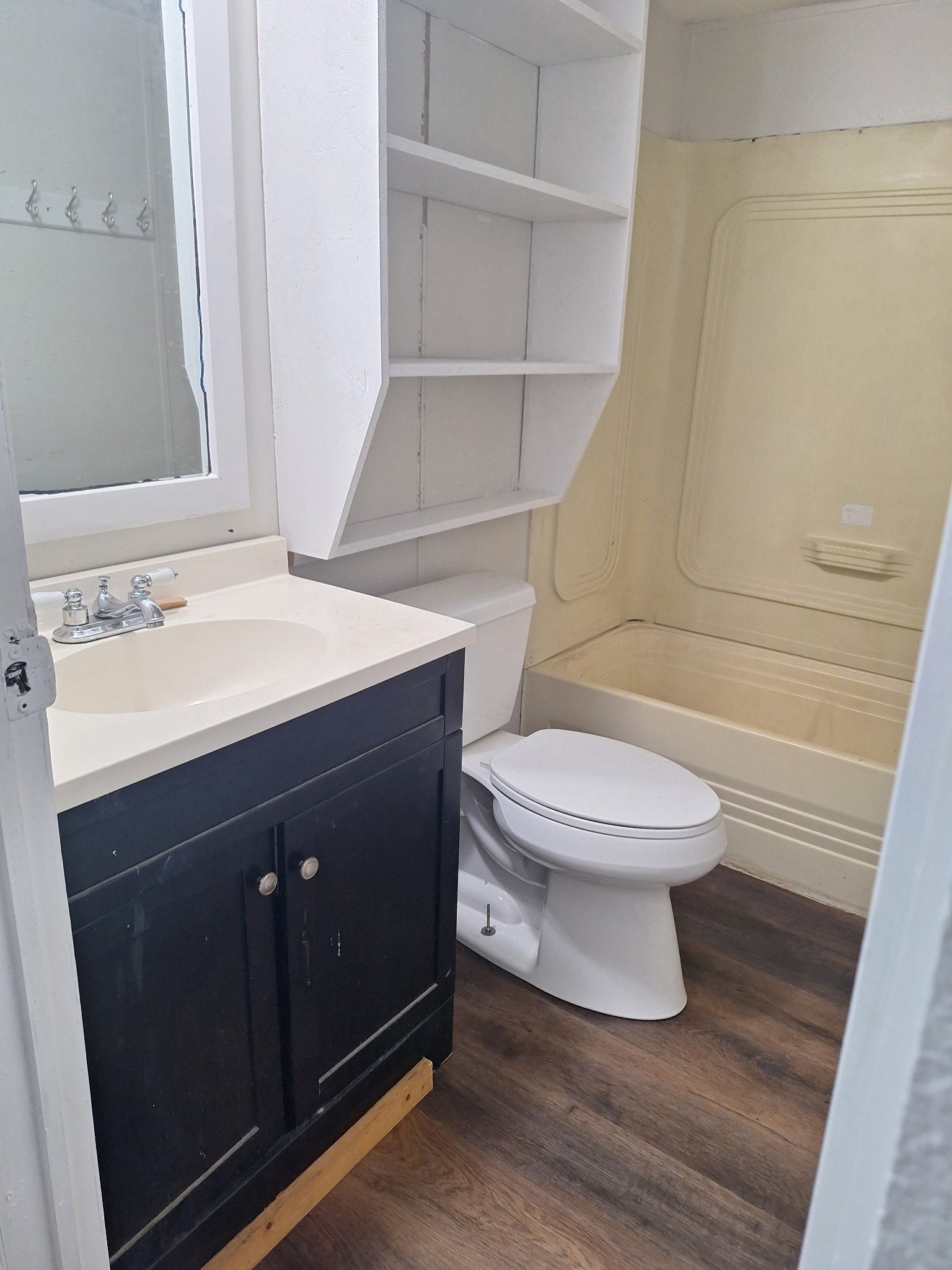 1308 County Road 159, Alvin, TX 77511 Bathroom featuring a vanity with storage, toilet, and shower/tub combination.