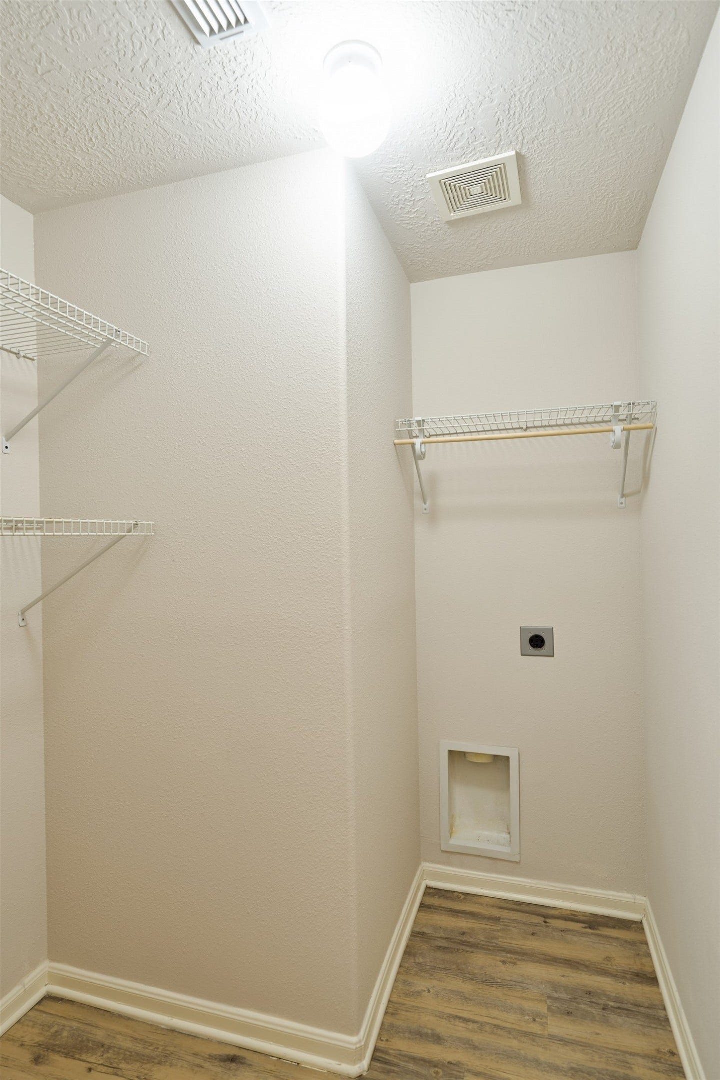 Utility room in the home in the hallway by the two secondary bedrooms.