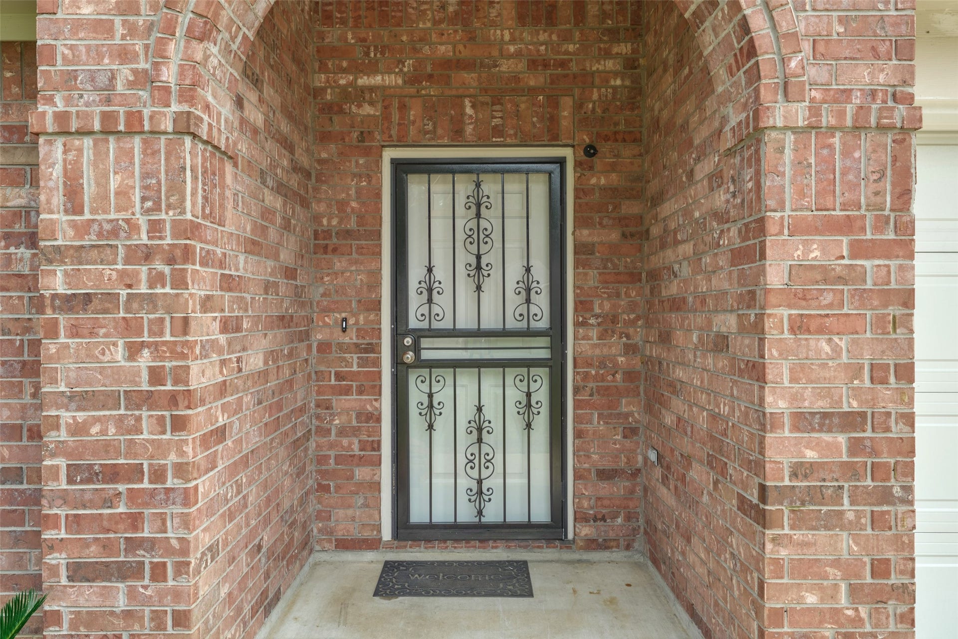 The front door has a glass screen door allowing for a full view of the front yard from inside the home and lets in light!