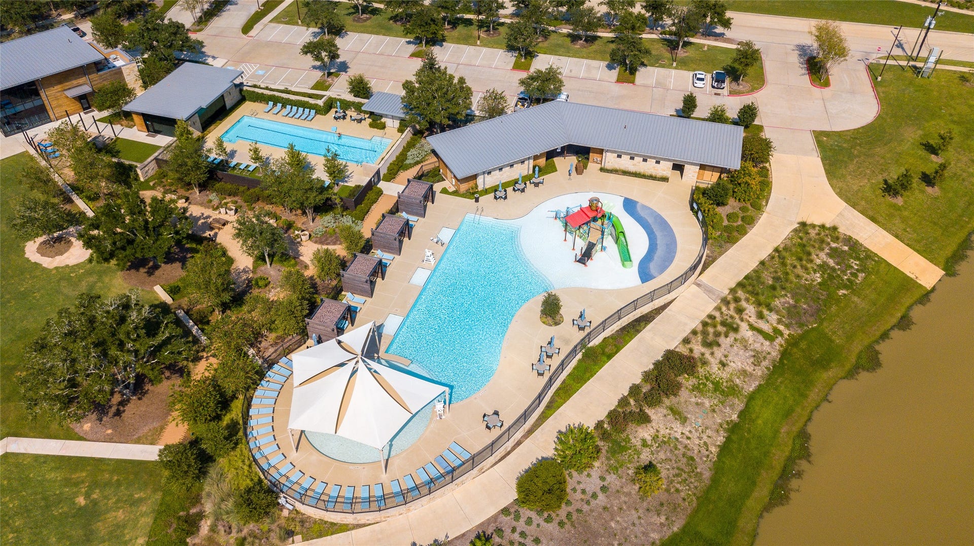 2419 Elmwood Trail, Katy, TX 77493 Enjoy beautifully designed pools, a dedicated splash pad, shaded lounge areas, and scenic surroundings that create the perfect setting for relaxation and recreation.