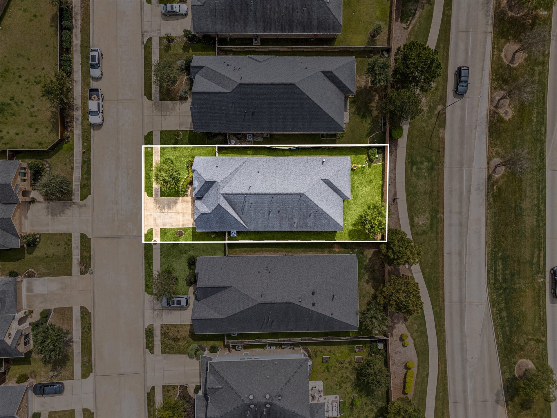 2419 Elmwood Trail, Katy, TX 77493 Property lines outlined to show the full lot size, highlighting the backyard space, driveway, and placement of the home within the neighborhood.