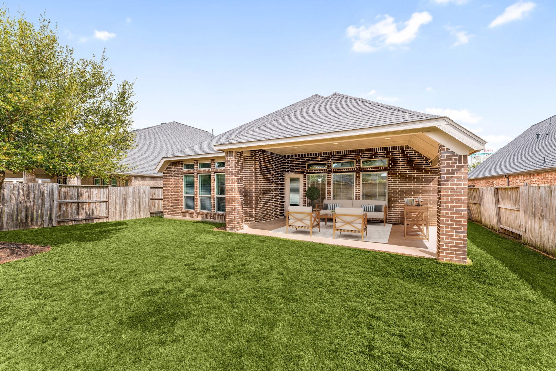 2419 Elmwood Trail, Katy, TX 77493 Spacious backyard with covered patio and plenty of green space, perfect for outdoor gatherings, relaxing, or play. Private yard with room to enjoy year-round.