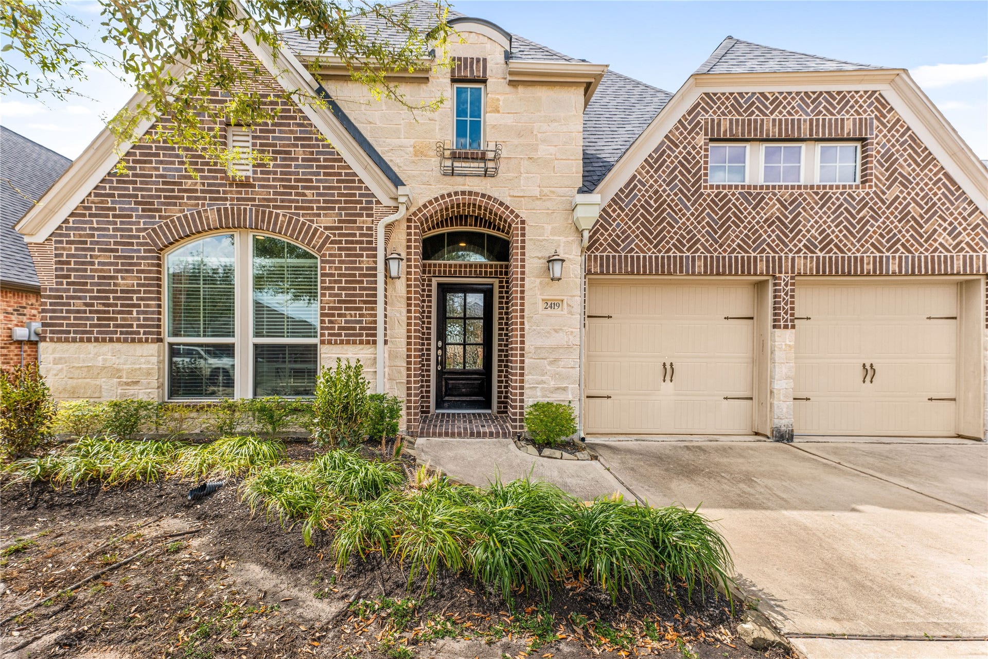 2419 Elmwood Trail, Katy, TX 77493 Welcome home to 2419 Elmwood Trail in the master-planned community of Cane Island, zoned to Katy Independent School District! This beautifully designed home offers 4 bedrooms, 3 full baths, a private office, and a 2-car garage. Inside, youll find elegant arched doorways and an open-concept layout ideal for entertaining. The chef-inspired kitchen features two-tone cabinetry, granite countertops, built-in stainless appliances, a designer tile backsplash, and an oversized island. The family room showcases a f