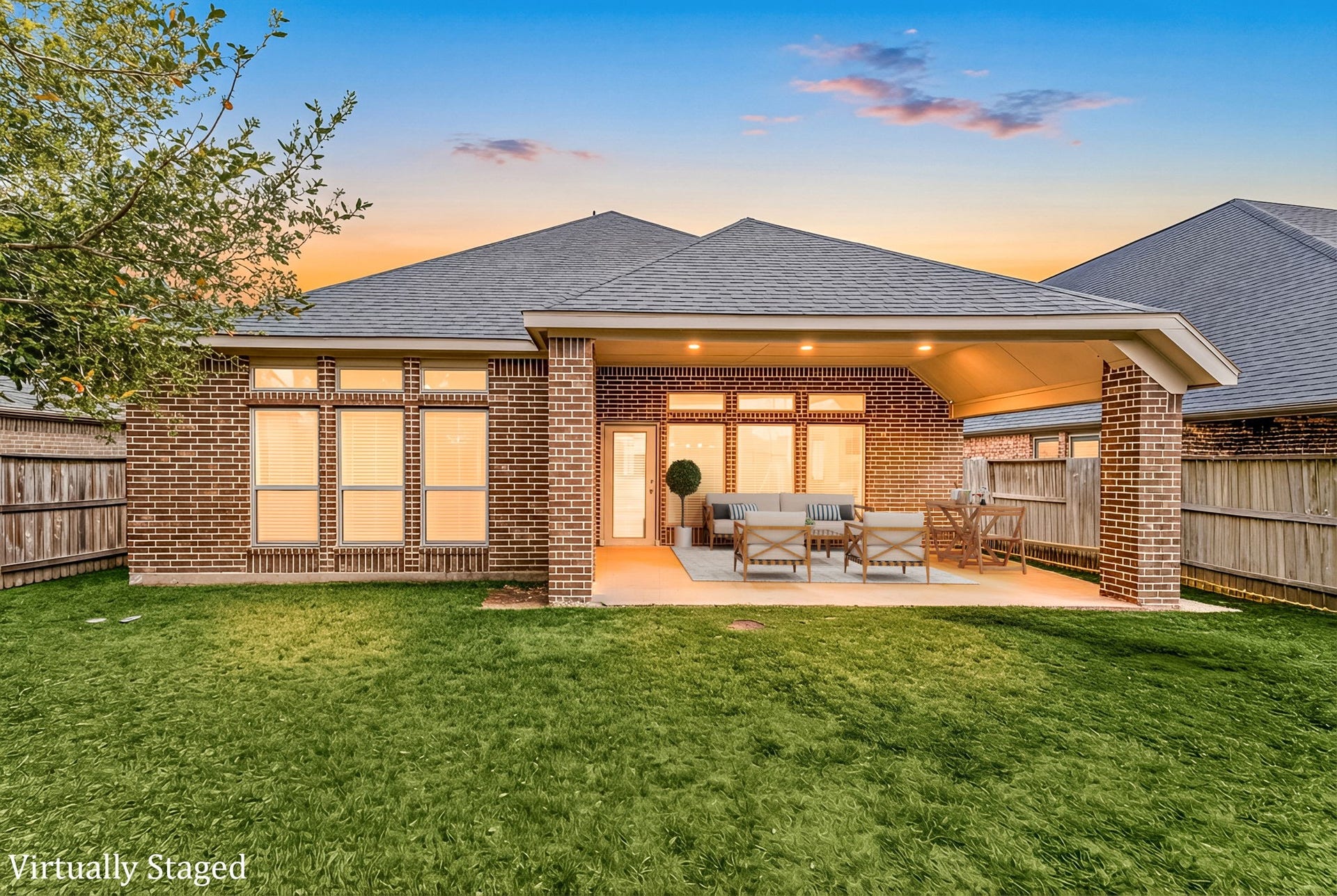 2419 Elmwood Trail, Katy, TX 77493 Beautiful covered patio with plenty of seating space, overlooking a private backyard, ideal for outdoor dining, entertaining, and year-round enjoyment.
