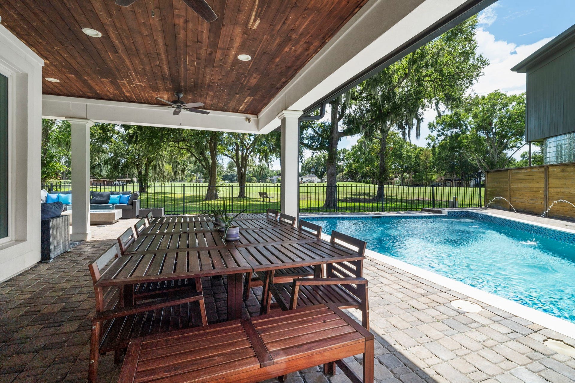 9 Charleston Street S, Sugar Land, TX 77478 The outdoor living experience is truly spectacular, featuring a heated pool and spa finished with glow-in-the-dark glass tilecreating a stunning ambiance from day into evening.
