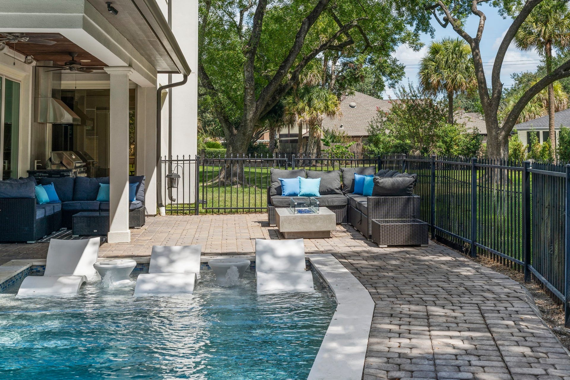 9 Charleston Street S, Sugar Land, TX 77478 A Baja shelf provides the perfect spot to relax poolside.