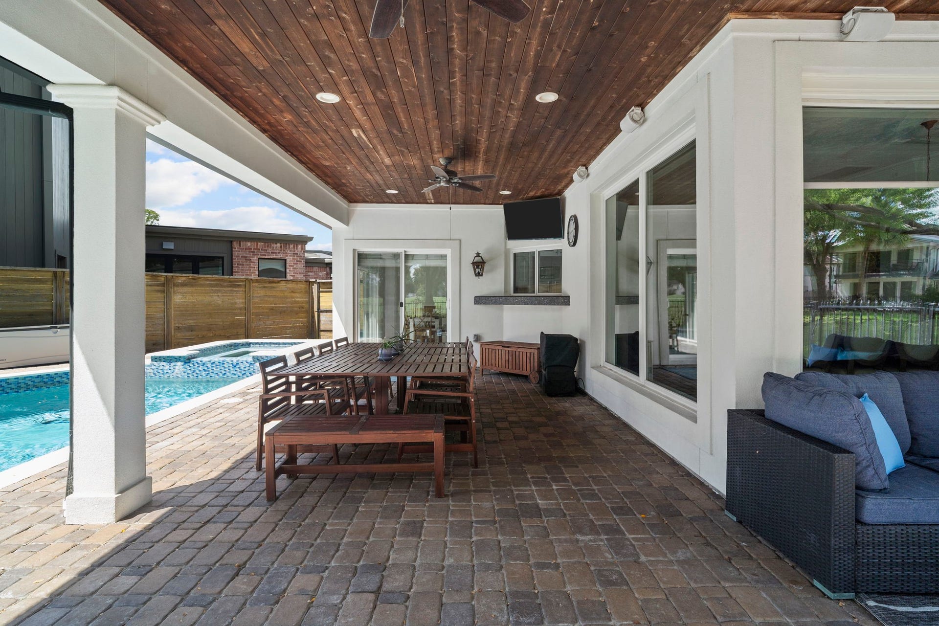 9 Charleston Street S, Sugar Land, TX 77478 The durable teak ceiling and timeless brick patio create a beautiful outdoor setting designed to stand the test of time, combining lasting performance with classic, enduring style.