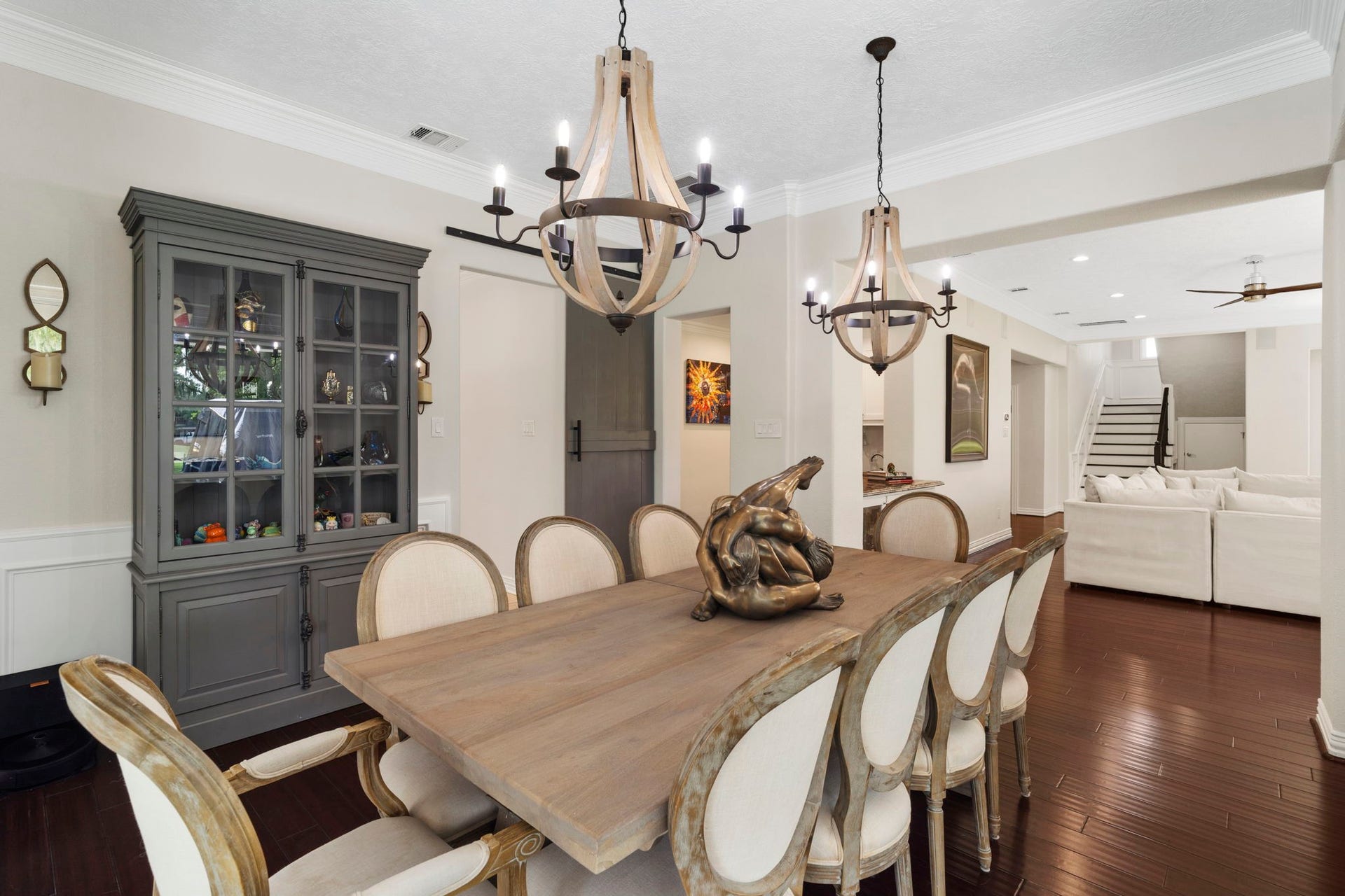 9 Charleston Street S, Sugar Land, TX 77478 Cove lighting adds a refined architectural detail to the dining room, creating a warm ambiance when illuminated.