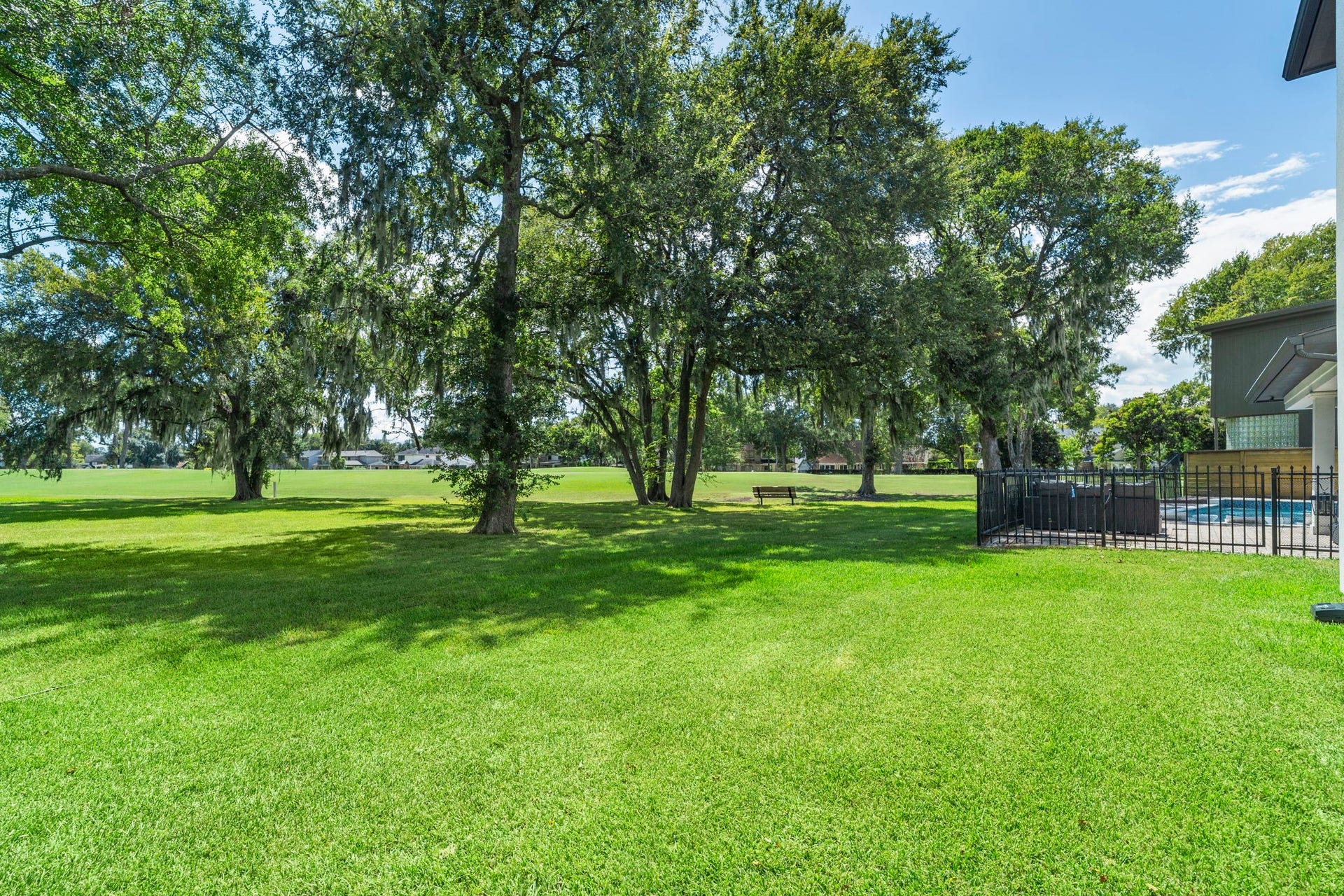9 Charleston Street S, Sugar Land, TX 77478 Set well back from the ninth fairway, the home enjoys a private setting with expansive, manicured grounds and beautiful golf course views along the edge of the fairway.