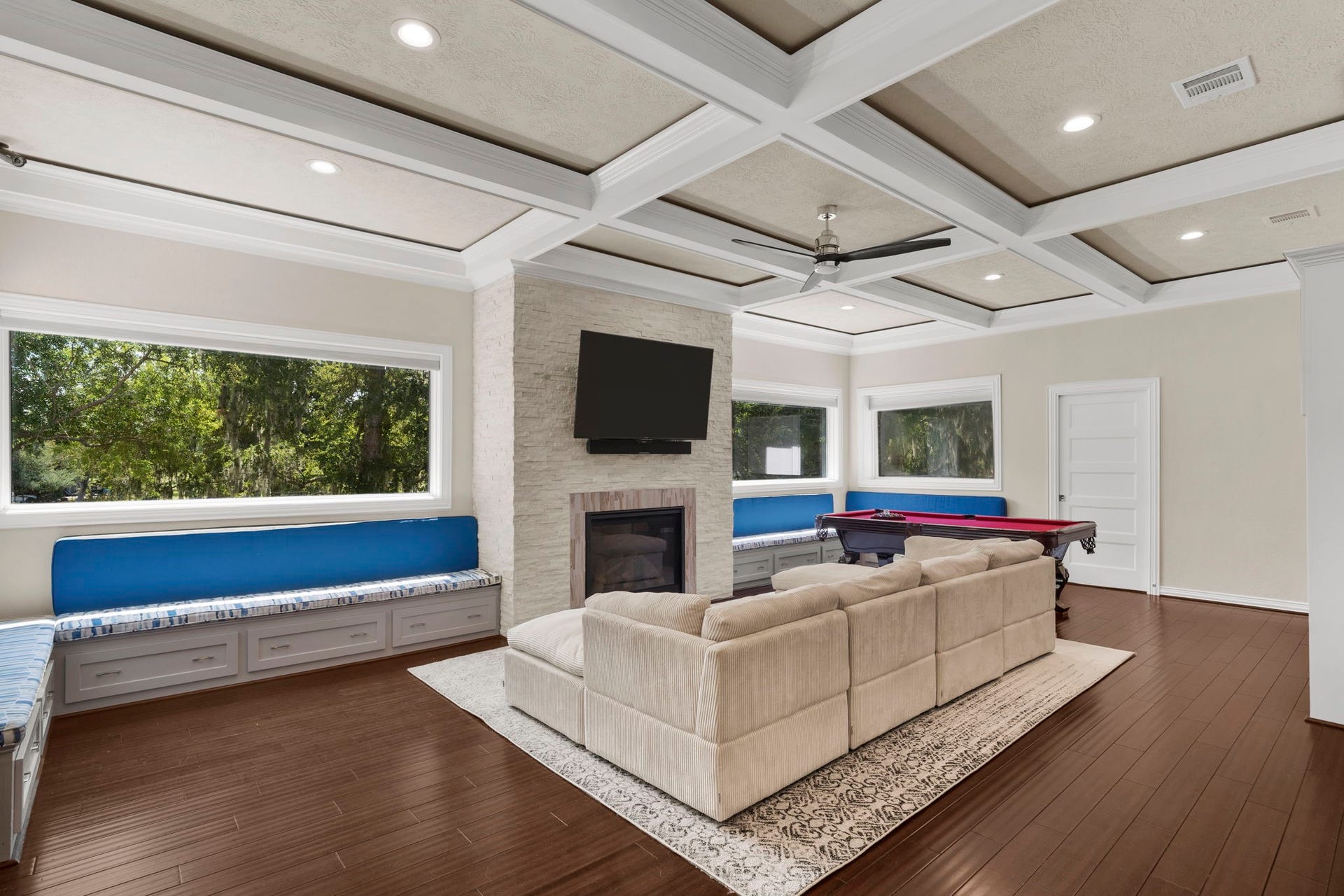 9 Charleston Street S, Sugar Land, TX 77478 Built-in window seats wrap around the perimeter of the game room, creating cozy spots to relax and enjoy the beautiful views through the large windows.